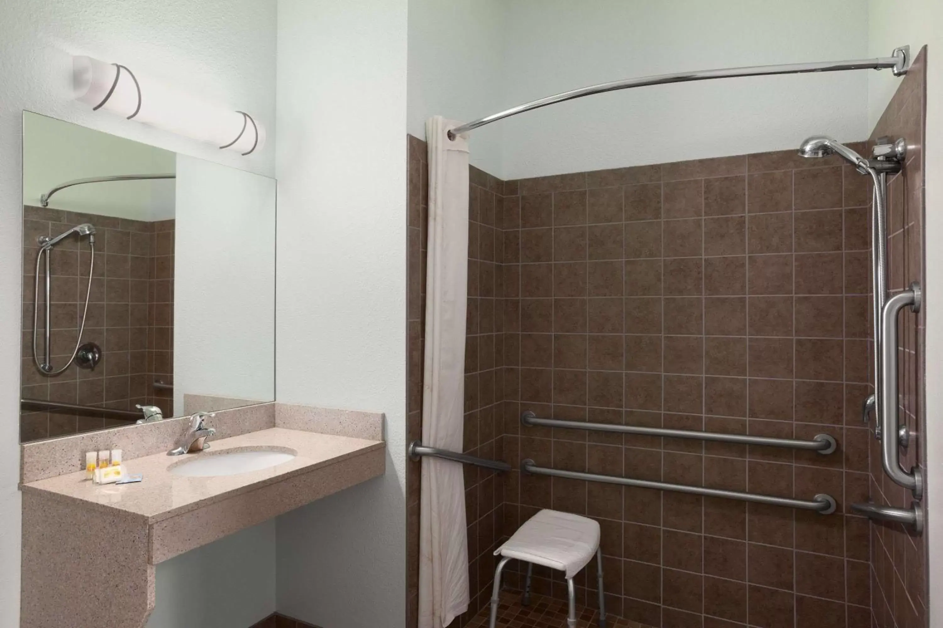 Bathroom in Days Inn & Suites by Wyndham Columbus NE