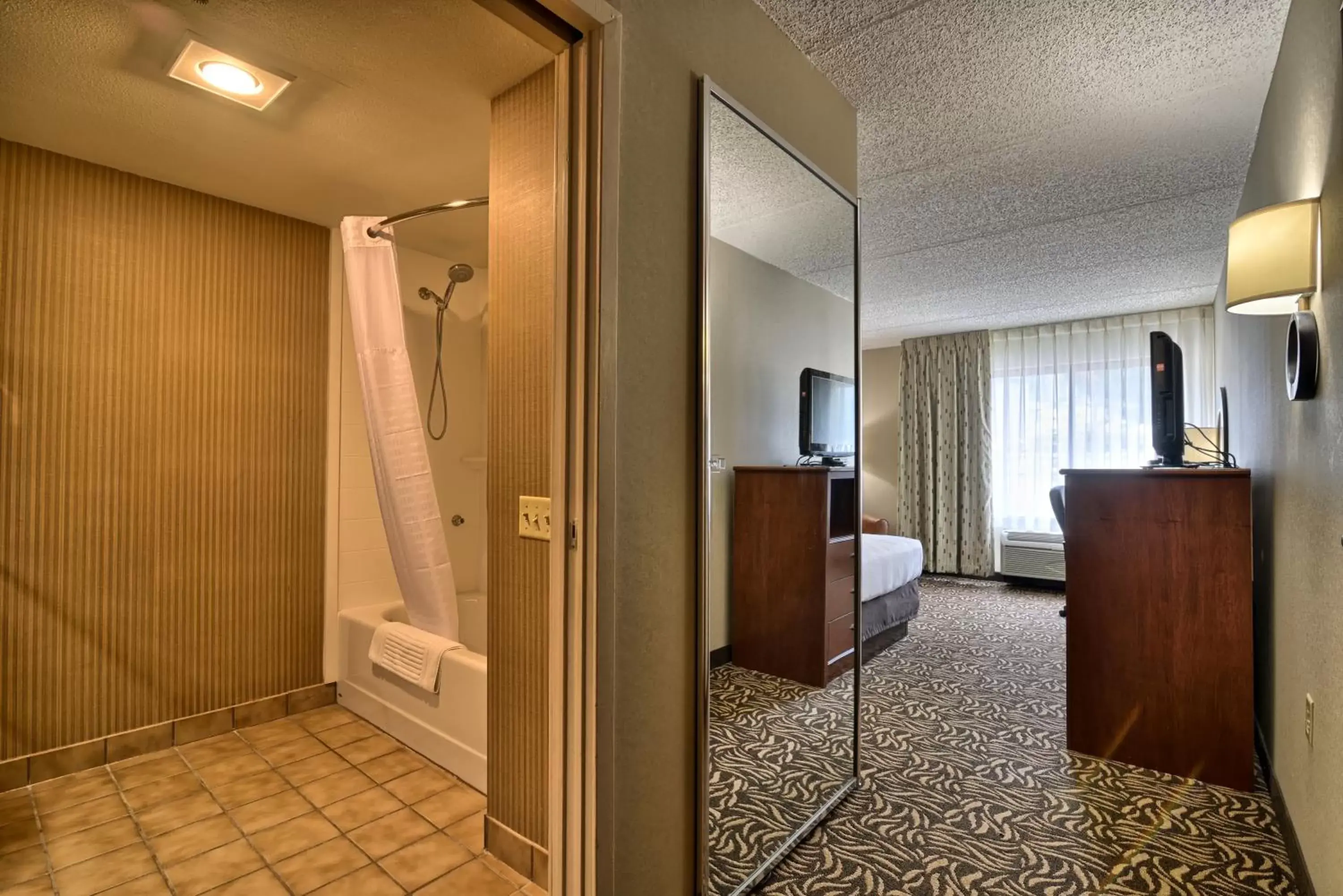 Property building, Bathroom in Clarion Inn & Suites - University Area