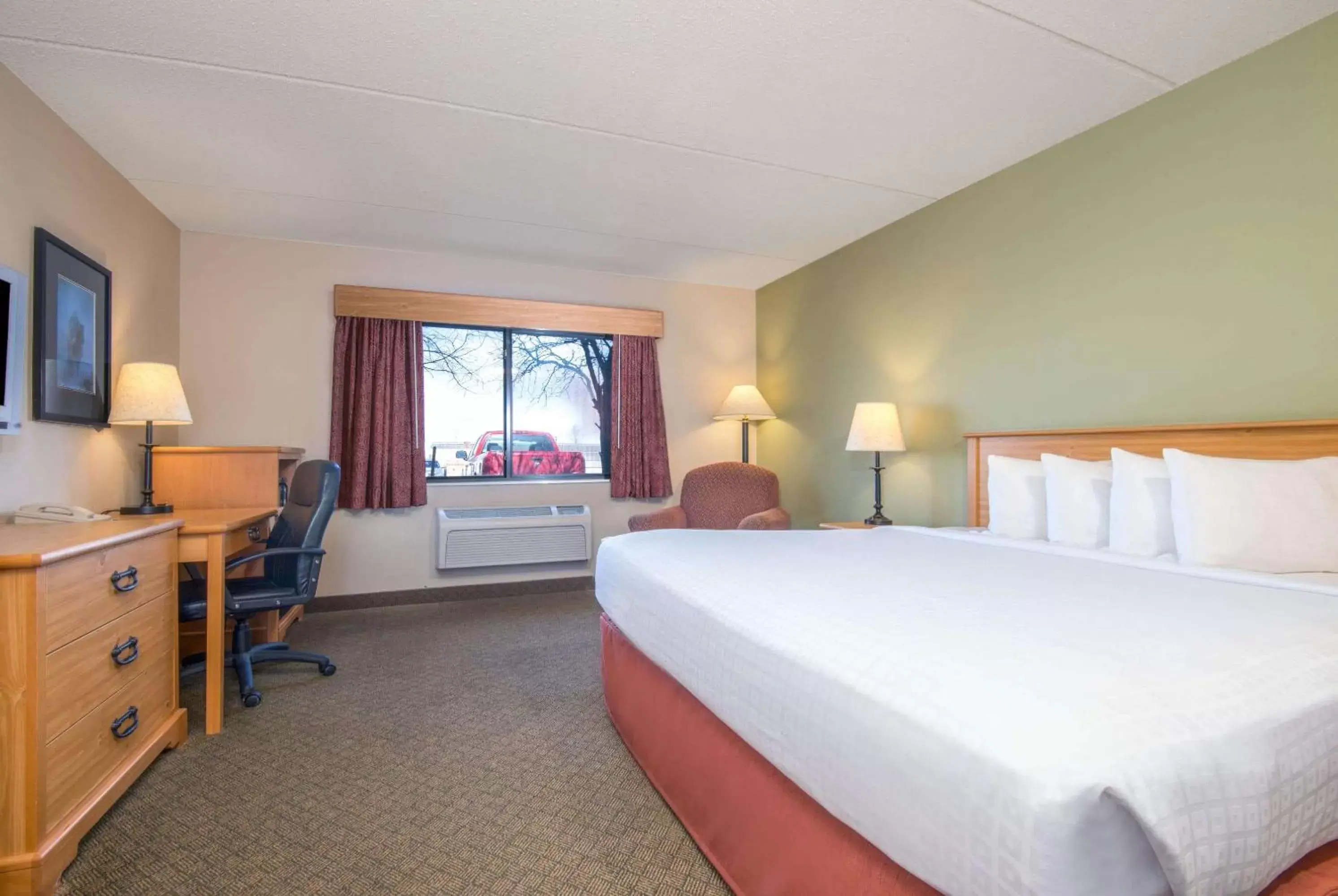 Photo of the whole room, Bed in AmericInn by Wyndham Pampa Event Center