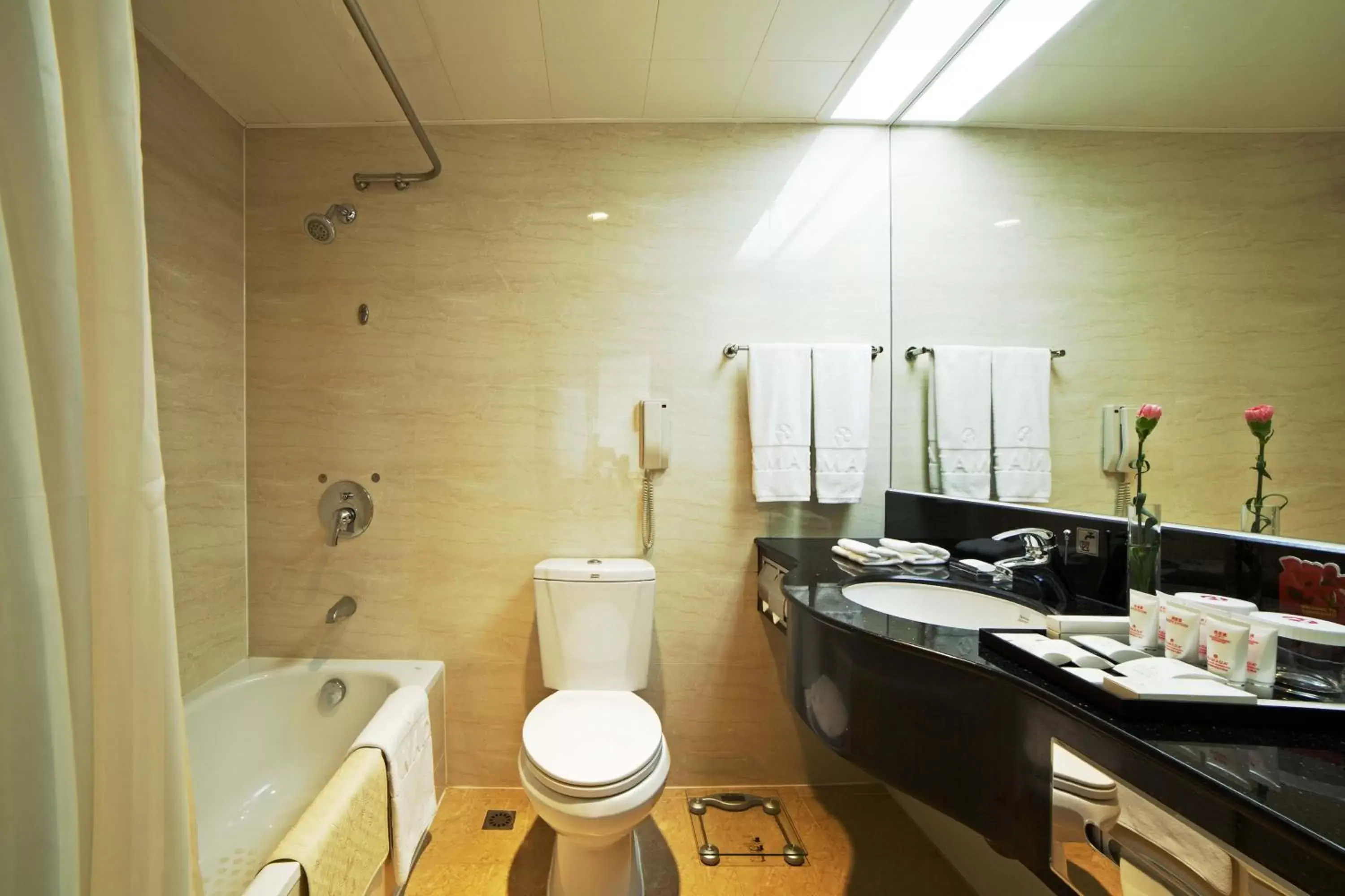 Bathroom in Ramada by Wyndham Pearl Guangzhou-Canton Fair Free Shuttle Bus