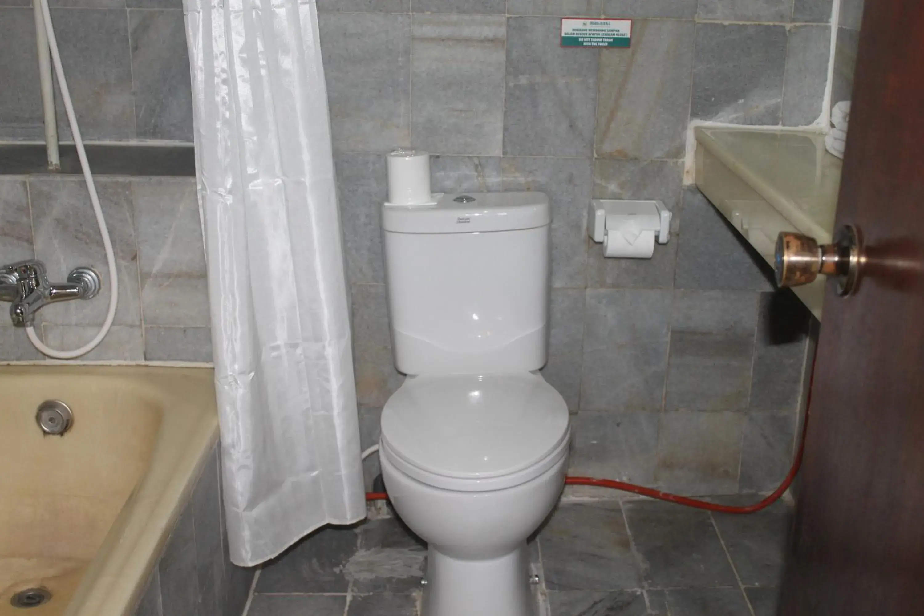 Bathroom in Melasti Kuta Bungalows & Spa