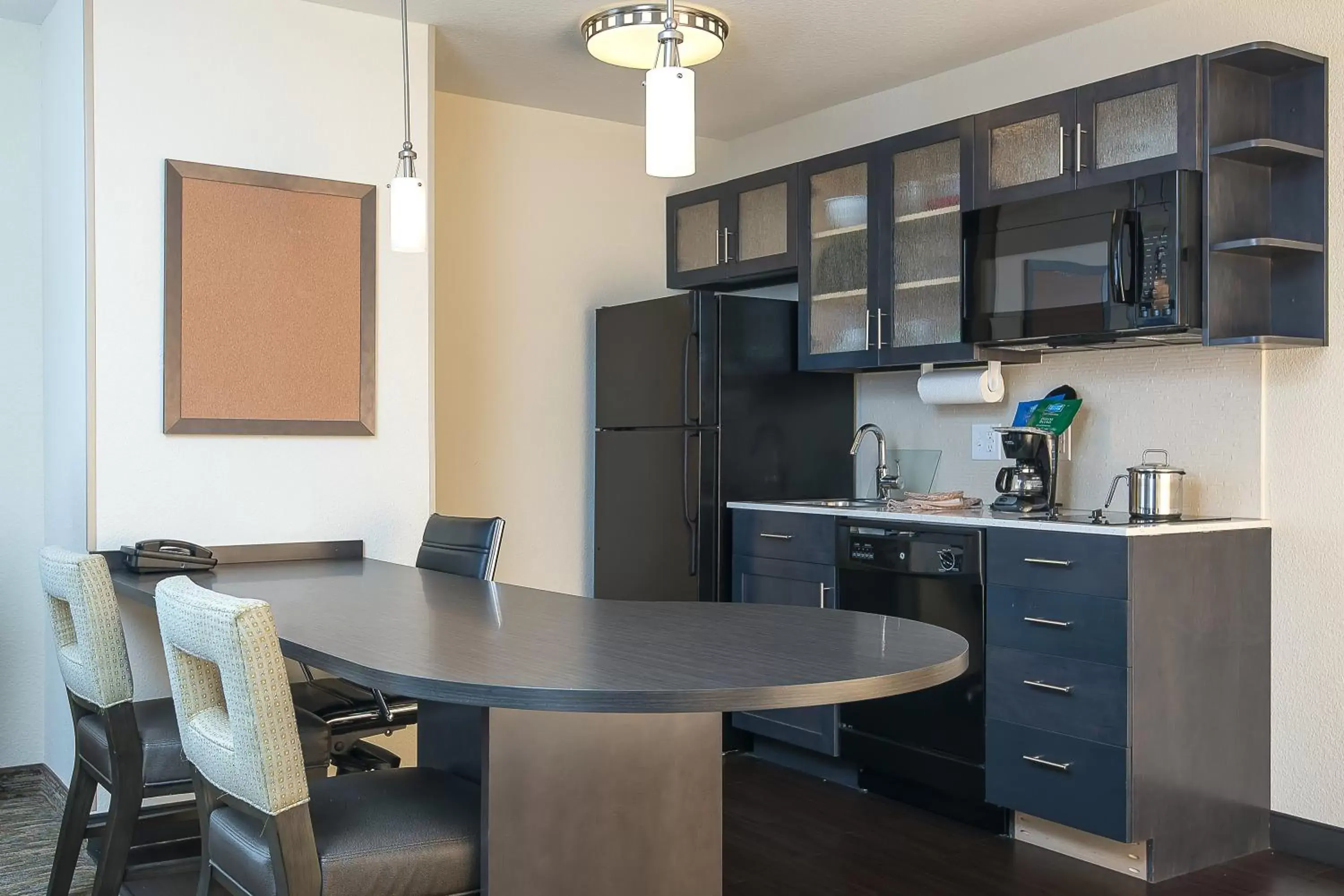 Photo of the whole room, Kitchen/Kitchenette in Candlewood Suites Bloomington, an IHG Hotel