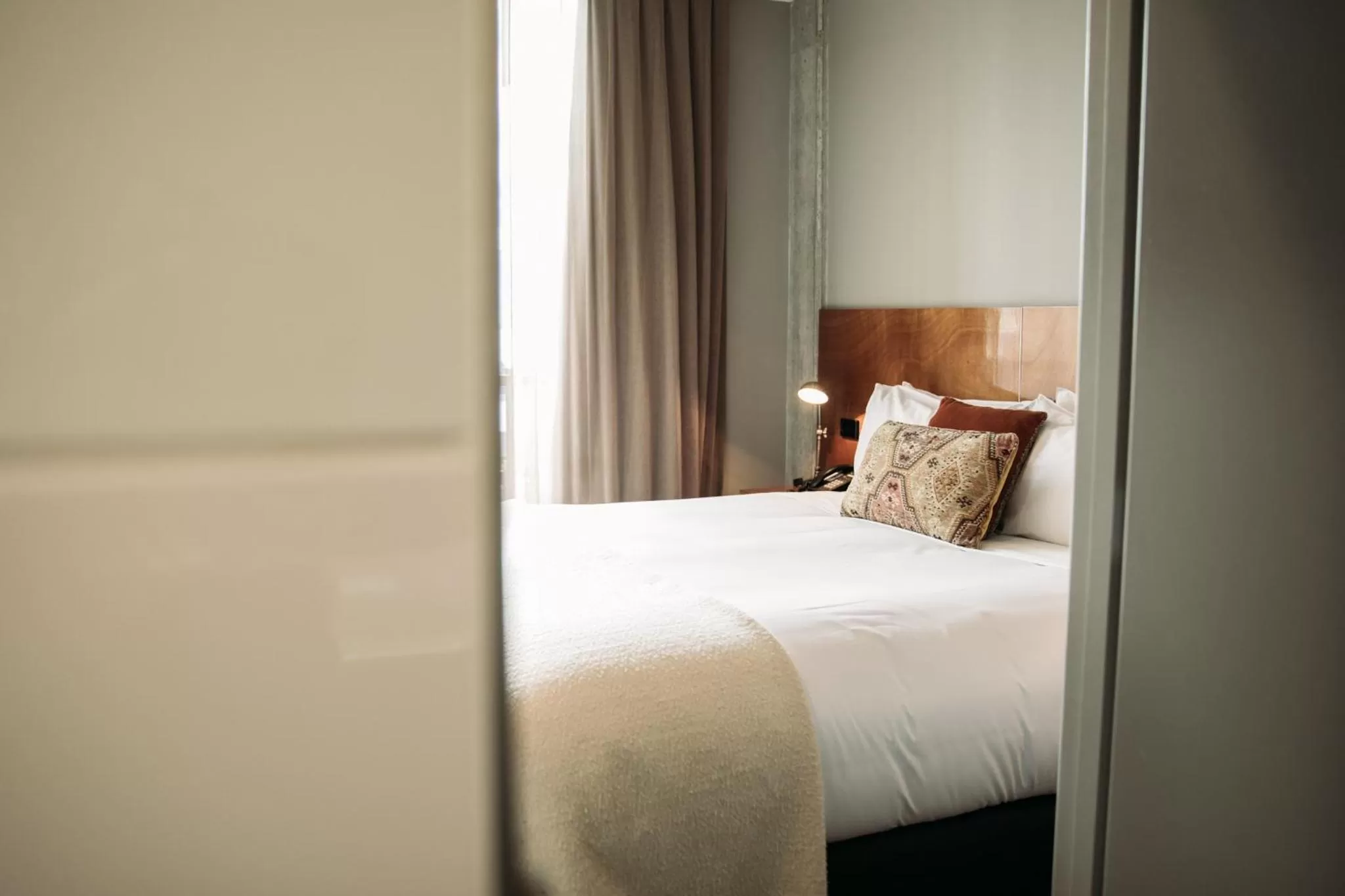 Bed in King and Queen Hotel Suites