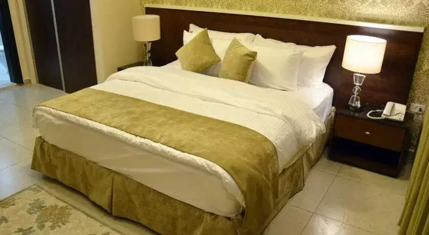Bed in City Rose Hotel Suites