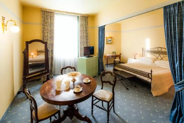 Bed in Cosmo Hotel Torri