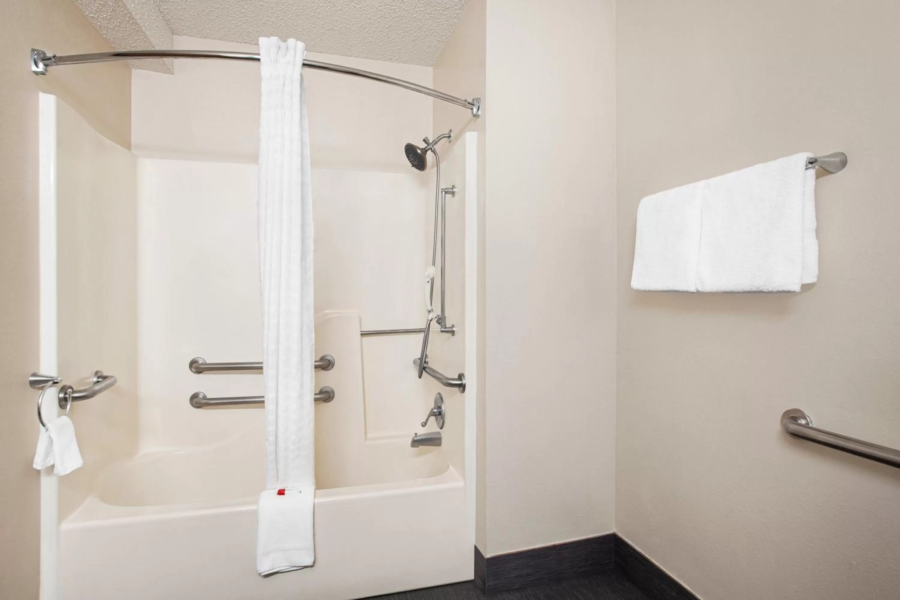 Bathroom in Super 8 by Wyndham Lenexa Overland Park Area/Mall Area