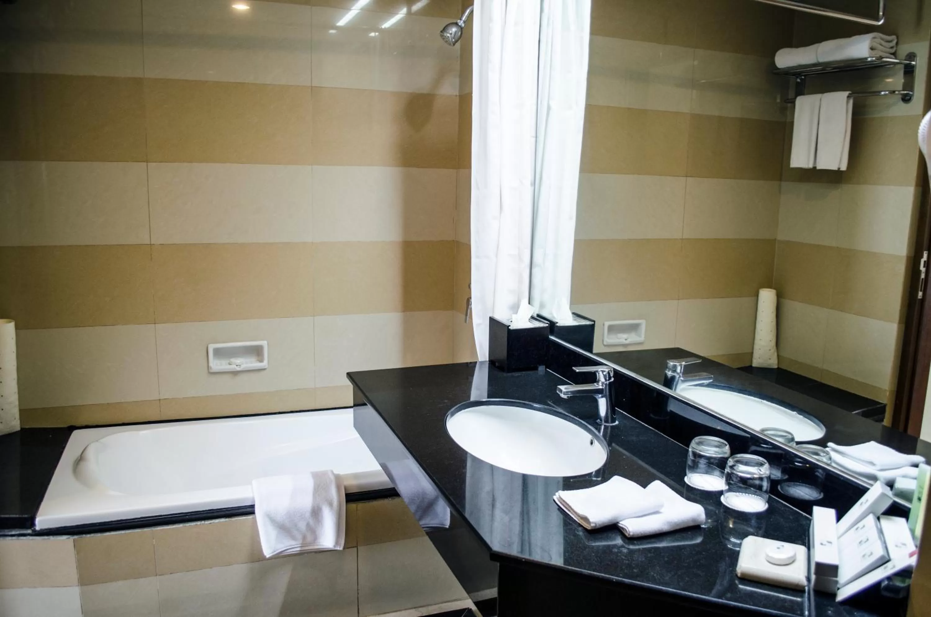 Bathroom, Bed in Swiss-Belhotel Maleosan Manado