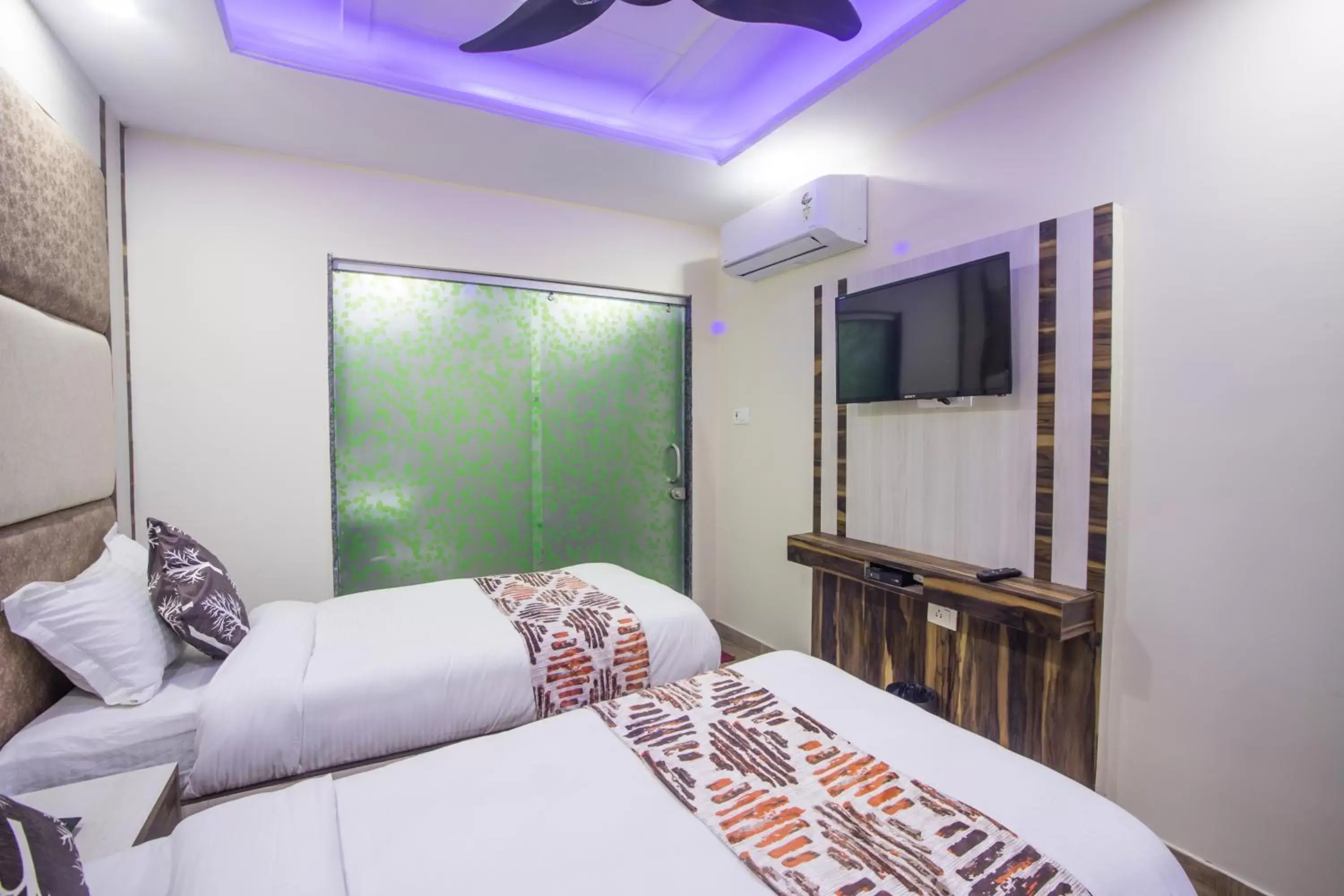 Bed in Hotel Harsha International