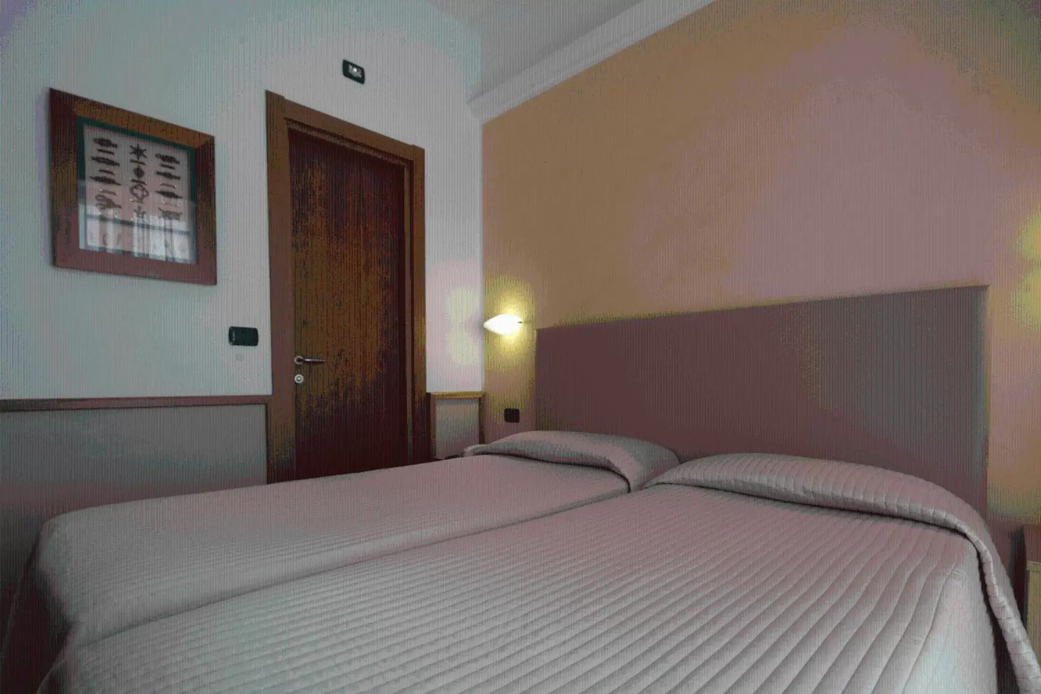 Bed in Hotel Florida Lerici