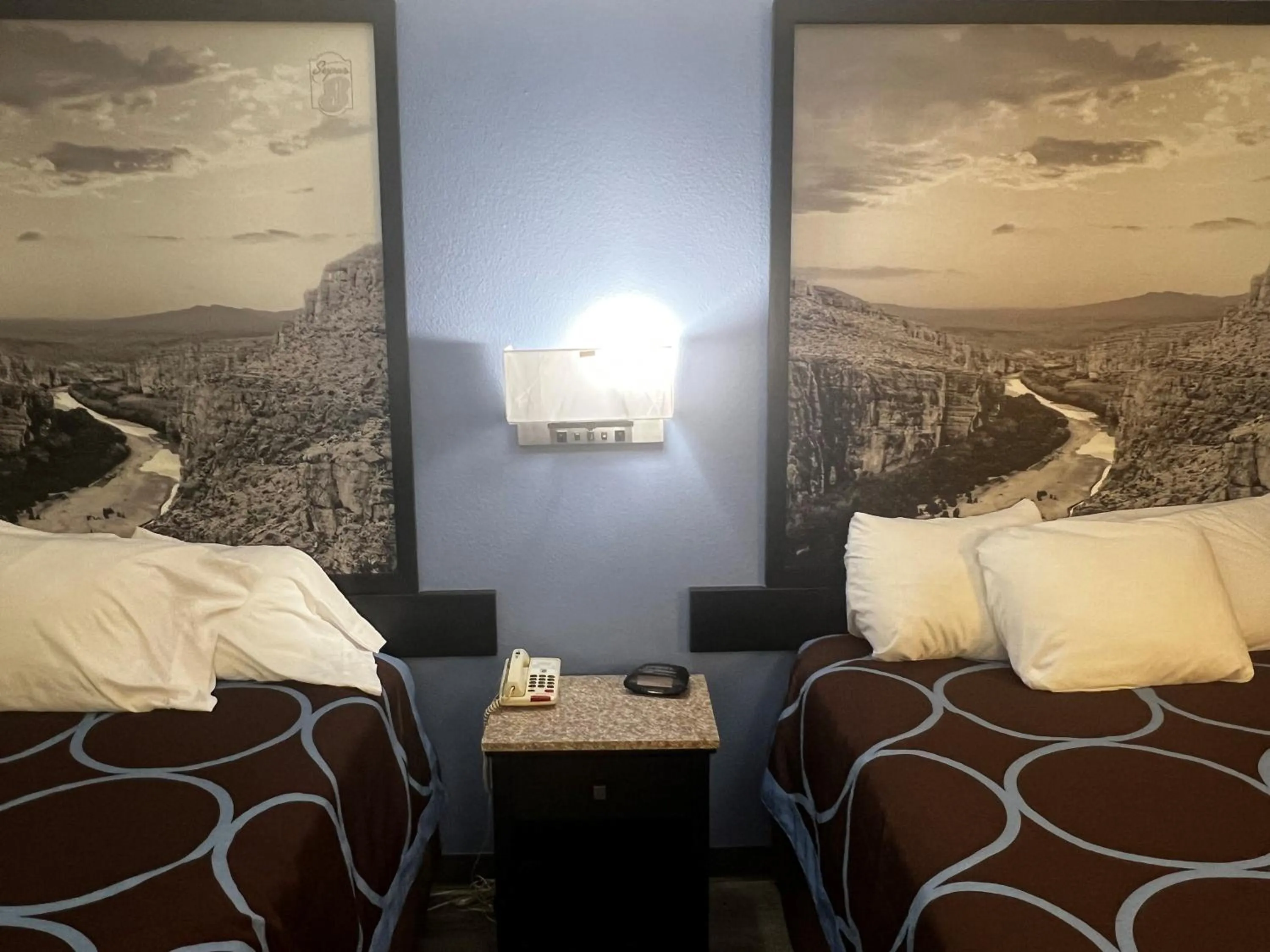 Bed in Super 8 by Wyndham Cleveland TX