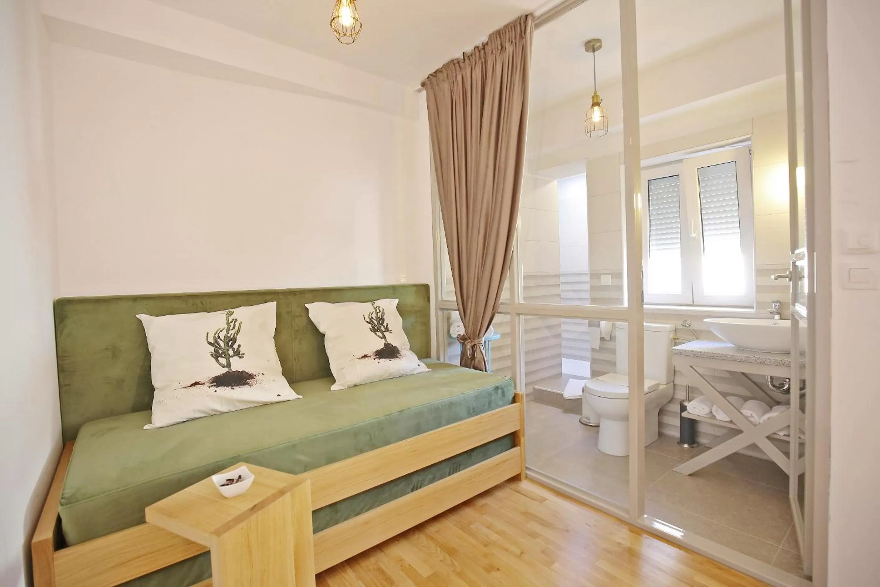 Toilet, Bed in Central Apartments Integrated Hotel