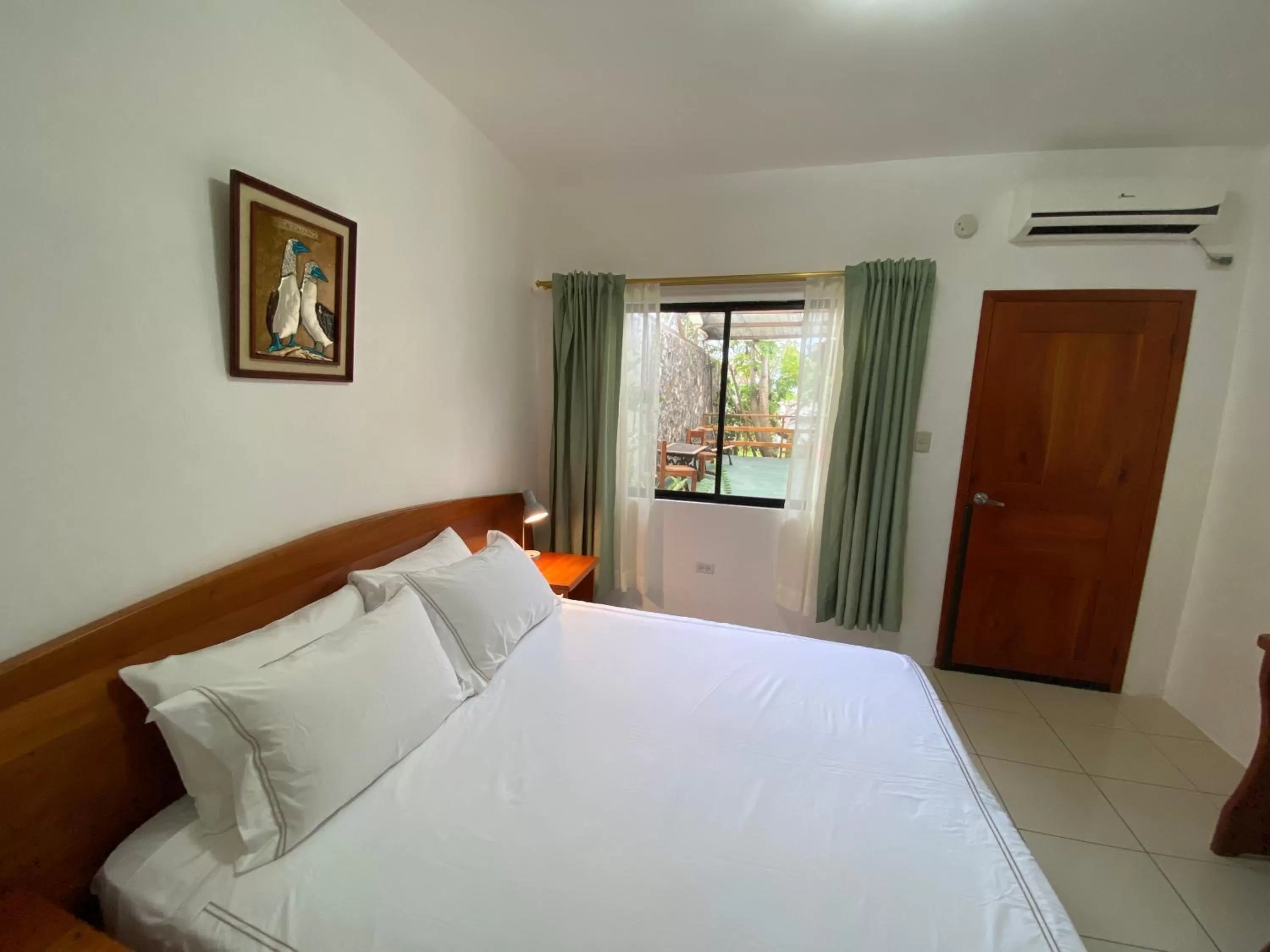 Bed in La Peregrina Galapagos B&B