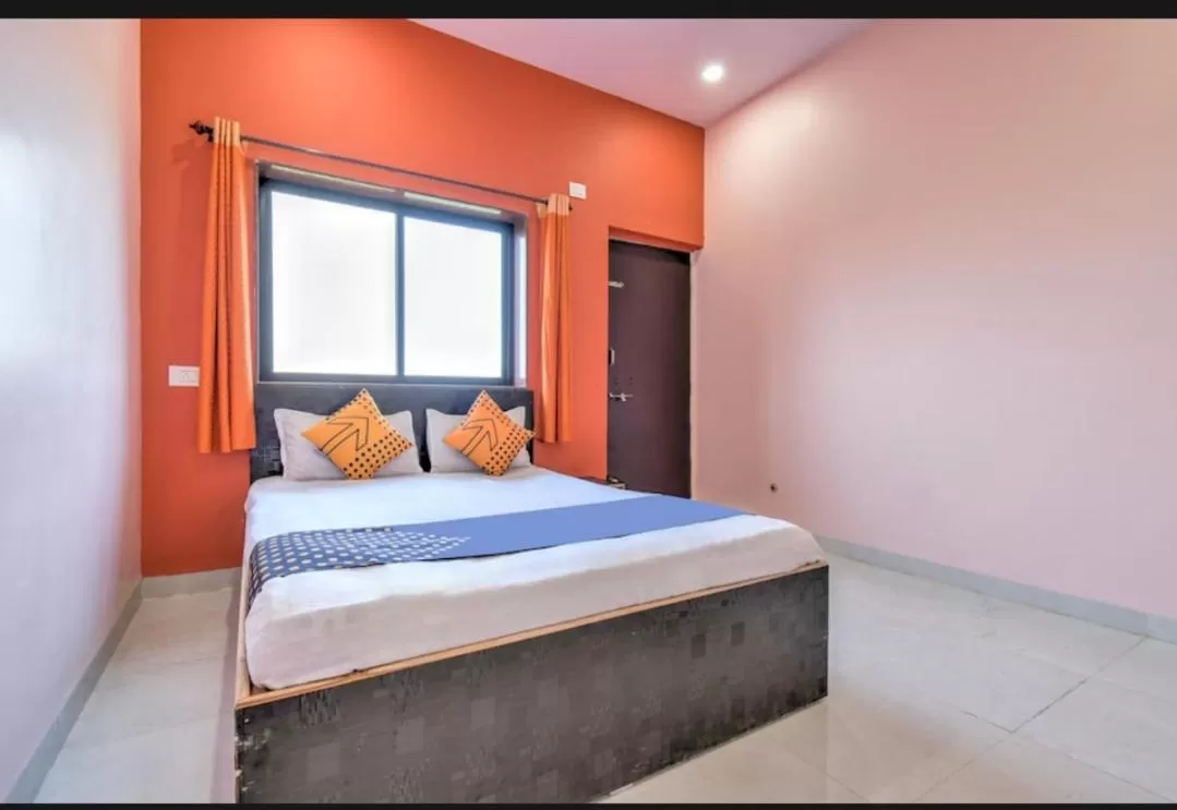 Bed in Hotel Nisarg Lodging And Restaurant