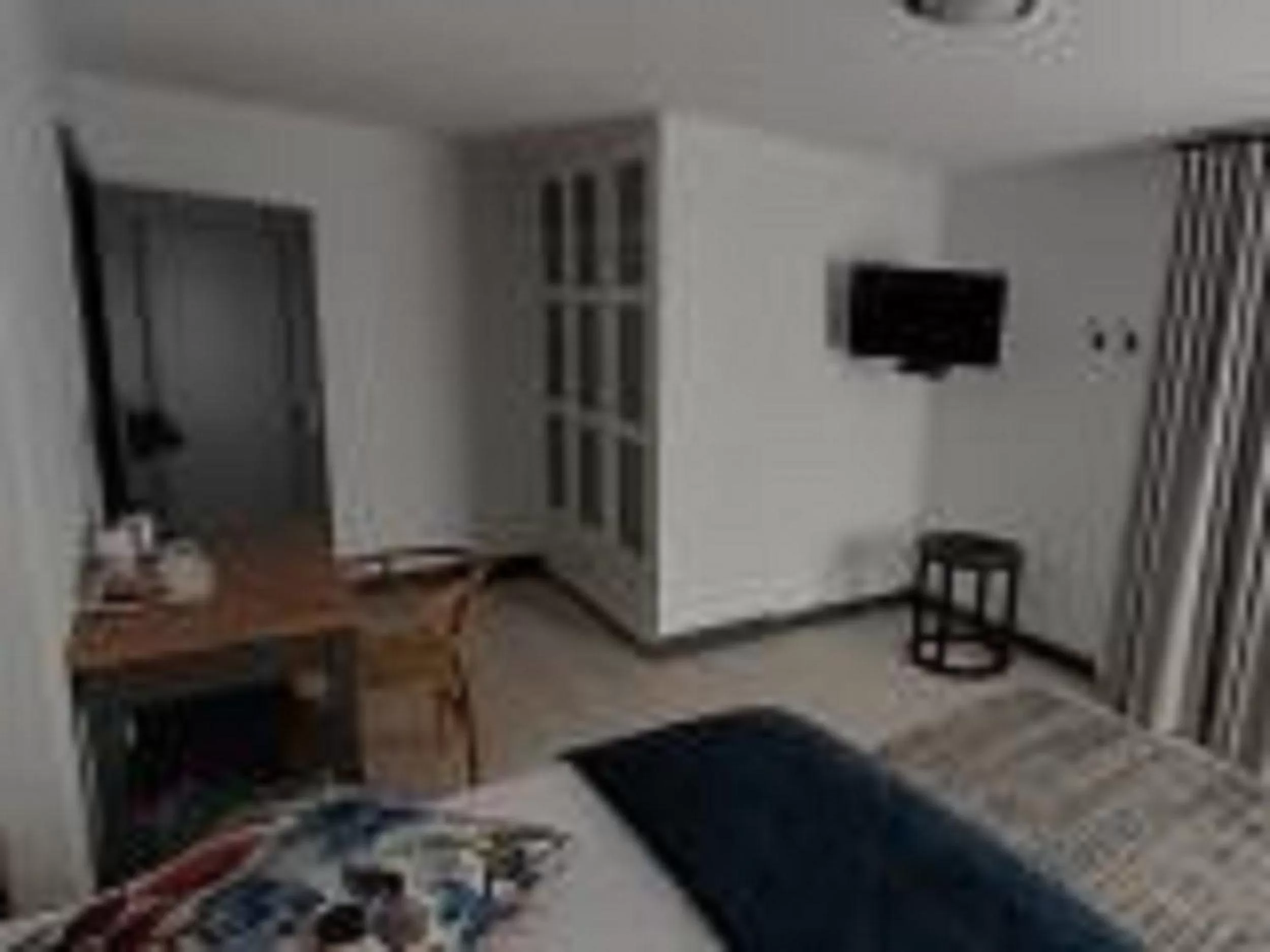 Communal lounge/ TV room, TV/Entertainment Center in Guesthouse Indongo Swakopmund