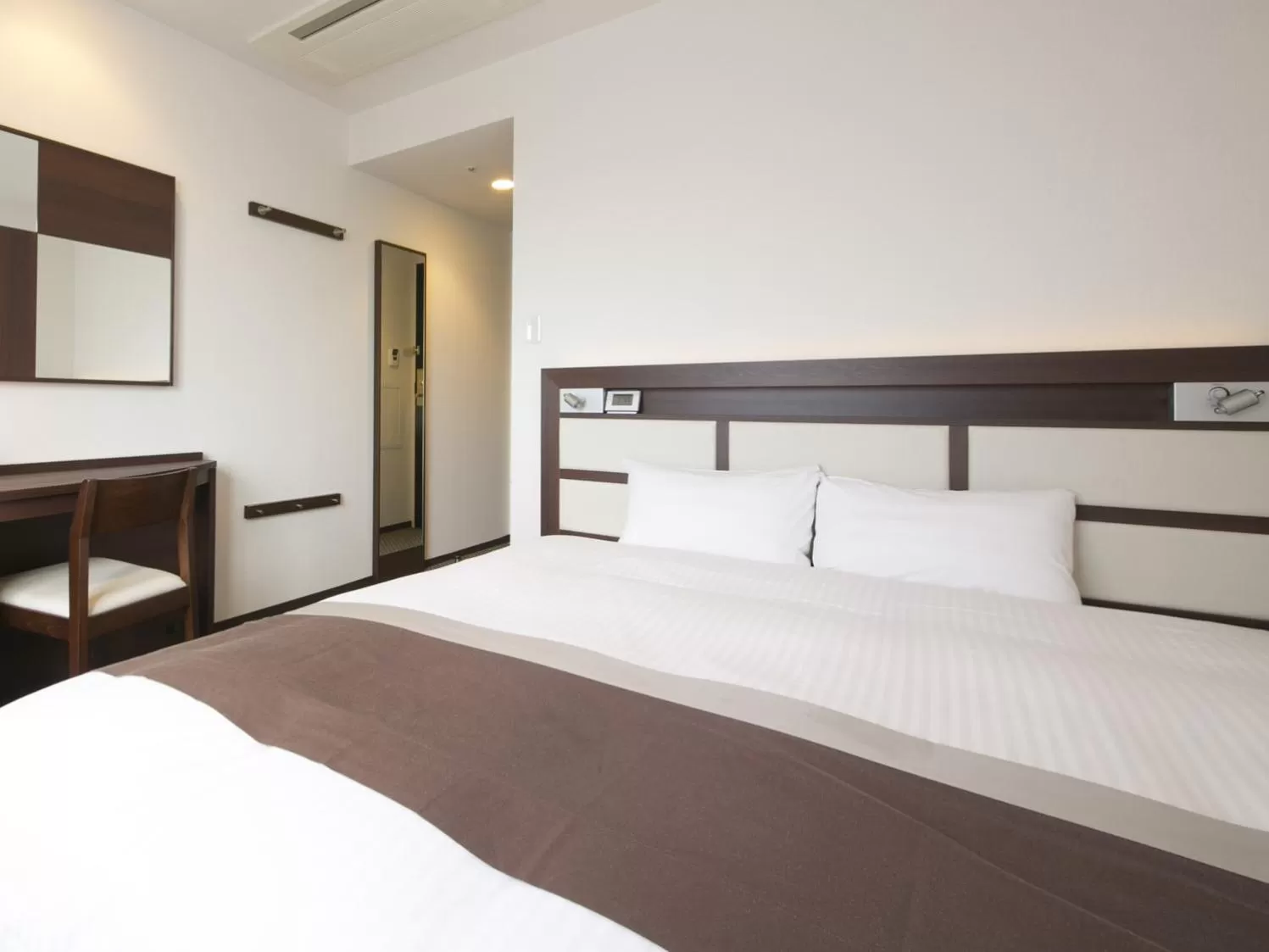 Bed in Urban Hotel Minami Kusatsu