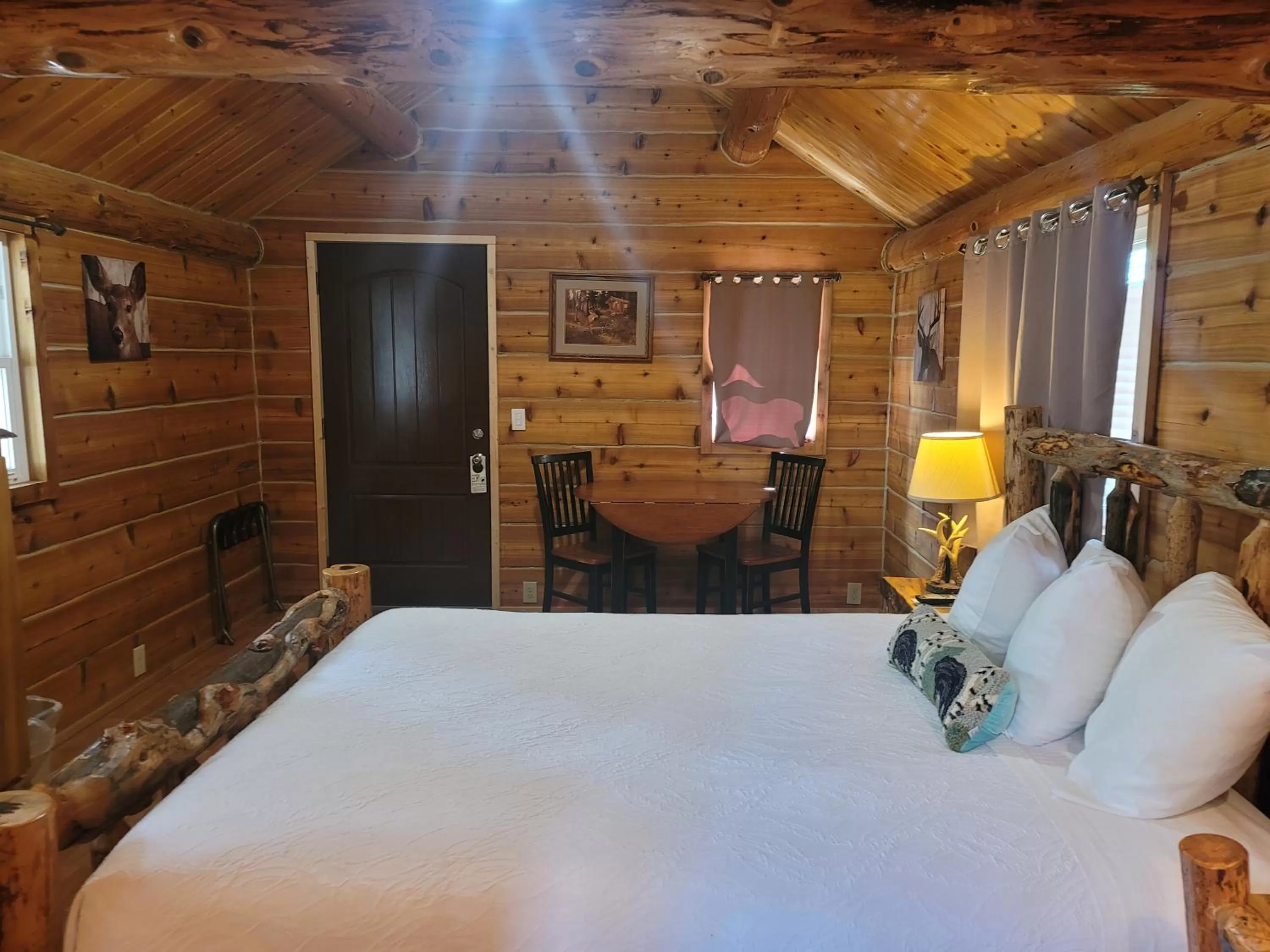 Bed in Riverfront Motel & Cabins