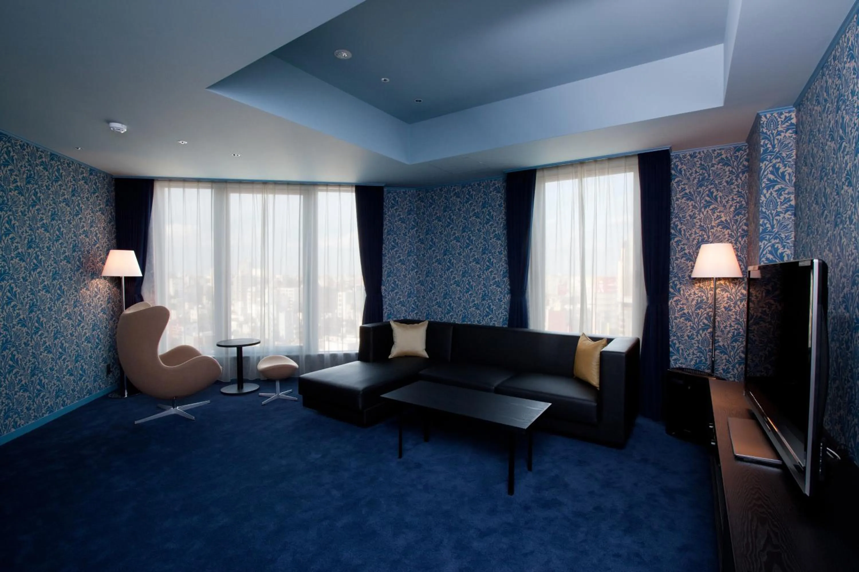 Living room in The Gate Hotel Kaminarimon by Hulic