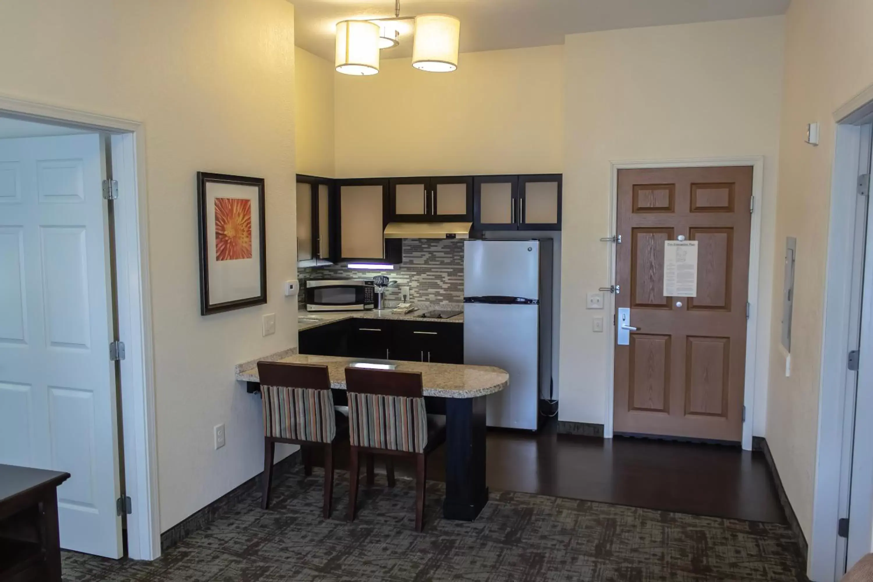 Kitchen/Kitchenette in Staybridge Suites Minot, an IHG Hotel