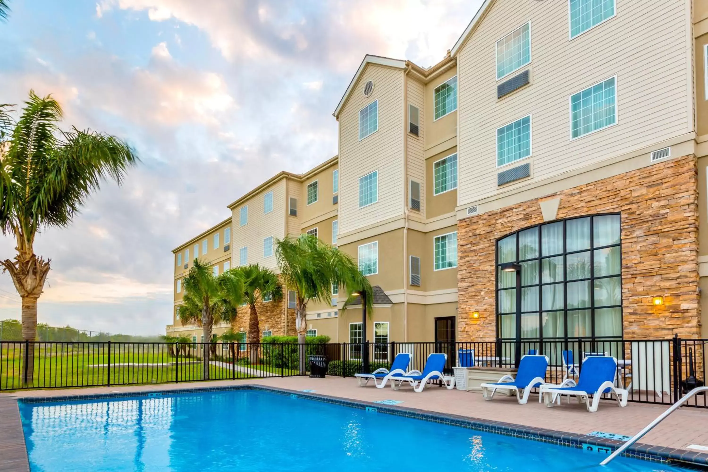 Swimming pool, Property Building in Staybridge Suites - Brownsville, an IHG Hotel