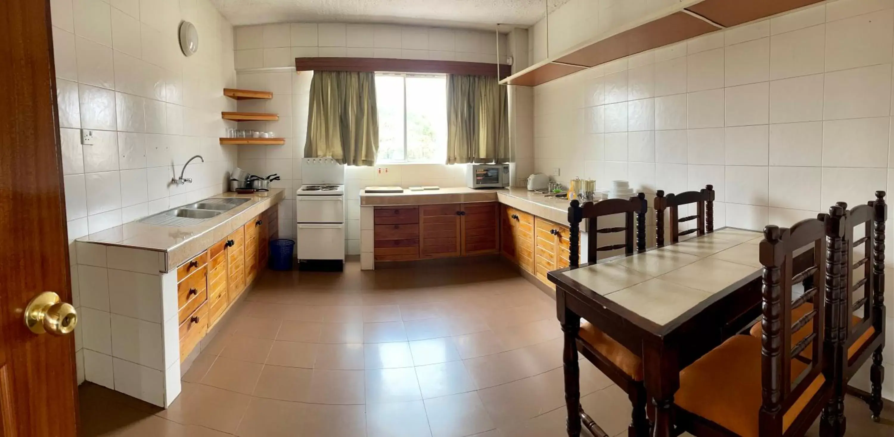 Kitchen/Kitchenette in Kenya Comfort Suites