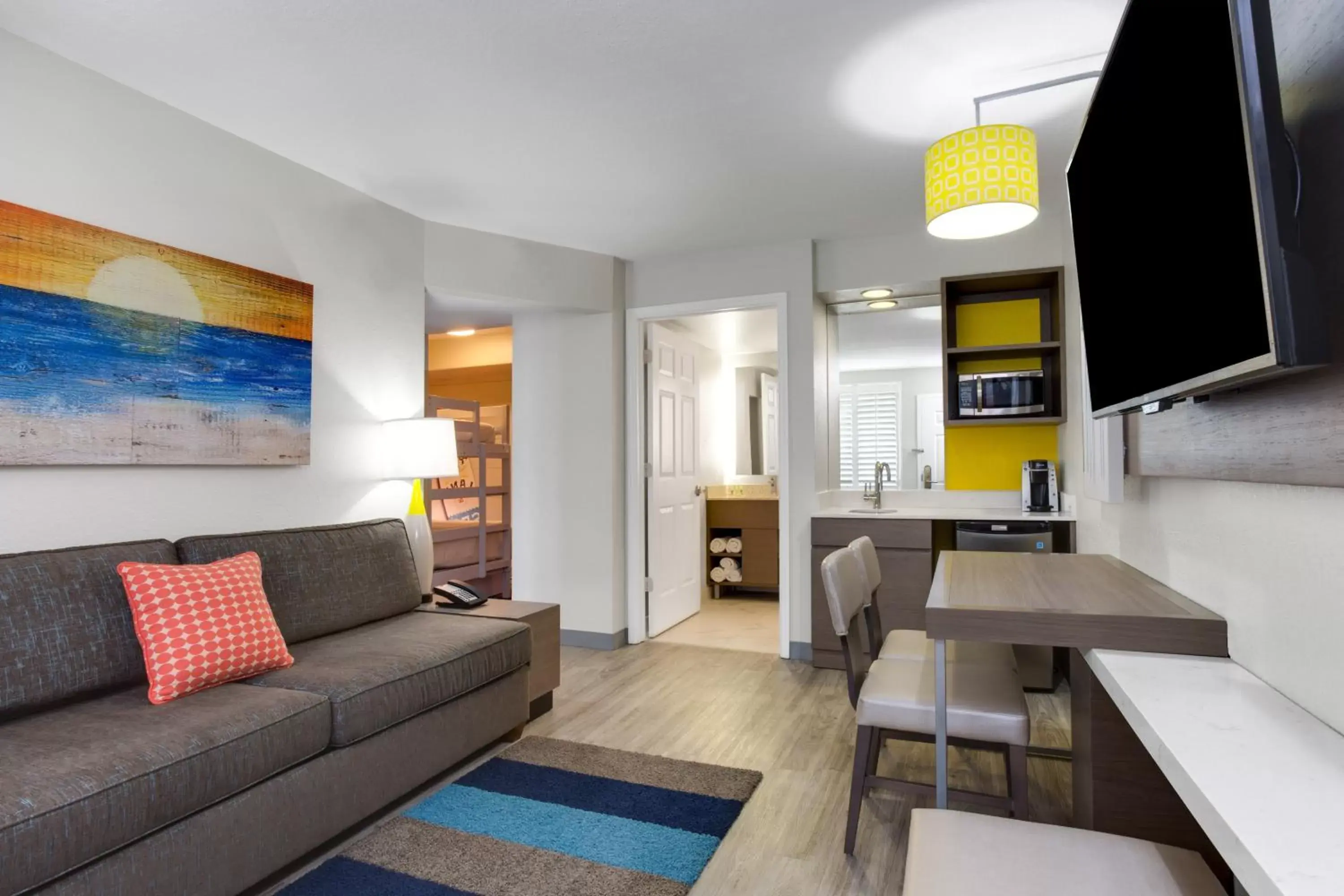 Bedroom, Seating Area in Holiday Inn Resort Orlando Suites - Waterpark, an IHG Hotel