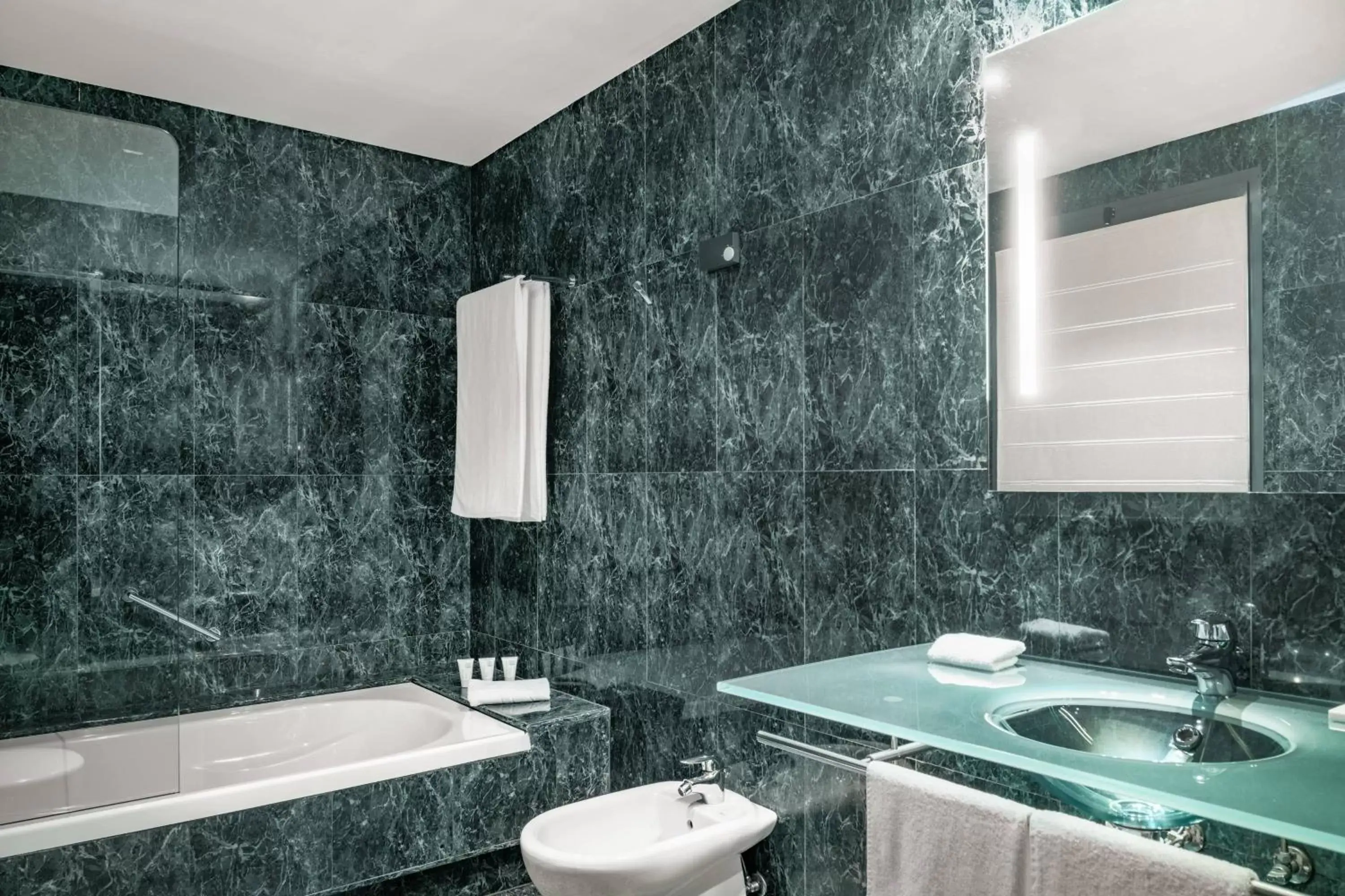Bathroom in AC Hotel Badajoz by Marriott