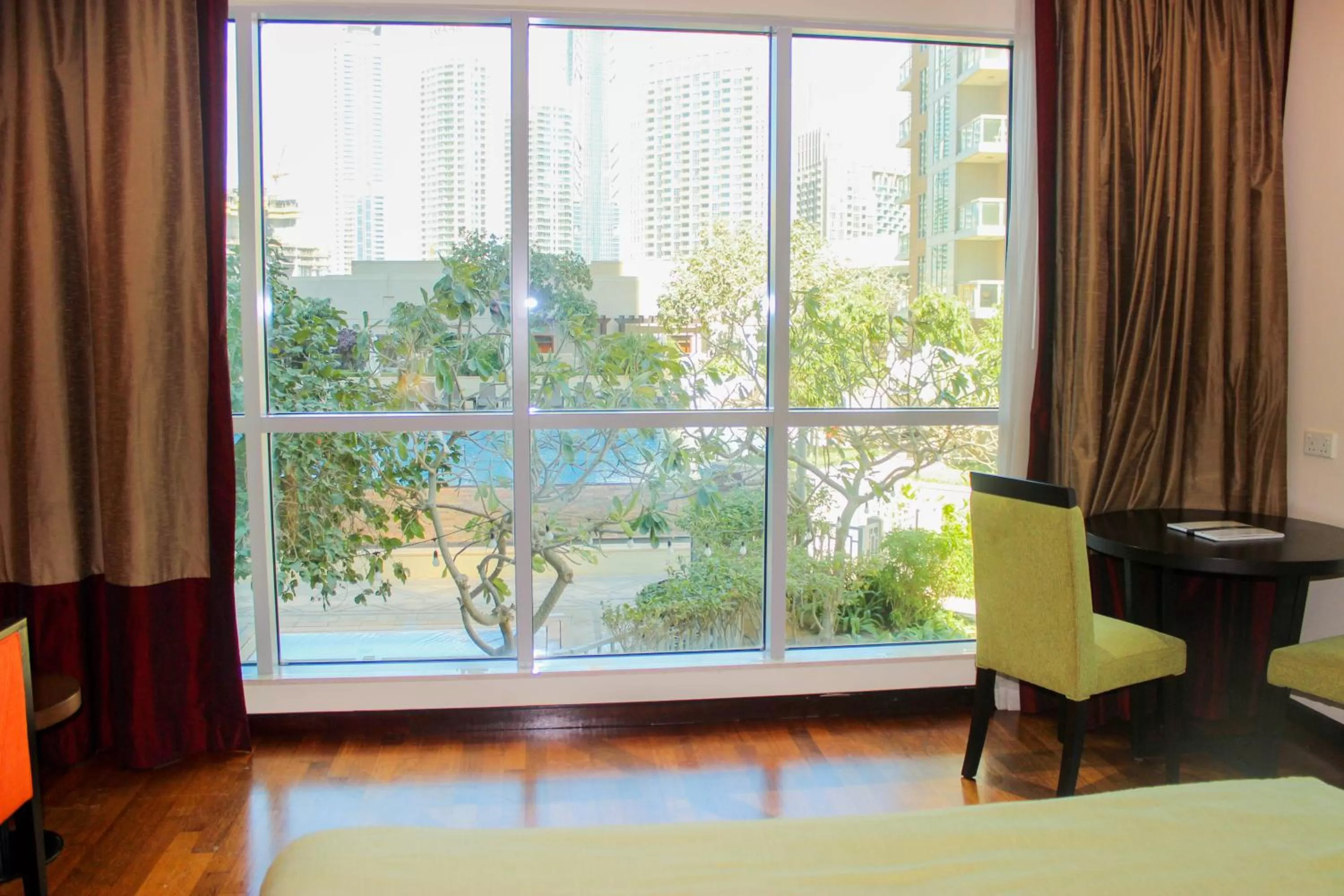 Dining area, Bed in Ramada by Wyndham Downtown Dubai