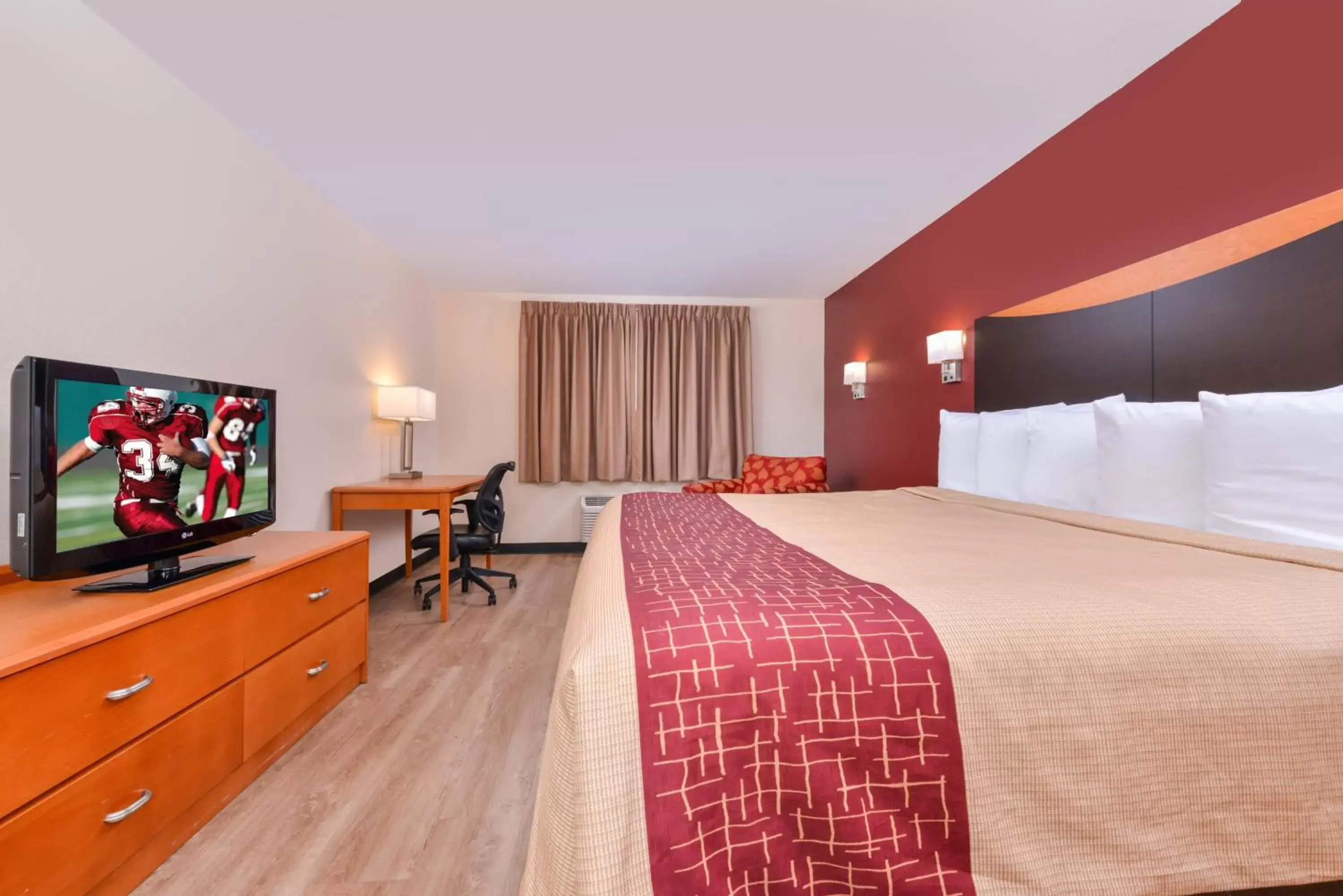 Photo of the whole room, TV/Entertainment Center in Red Roof Inn & Suites Danville, IL