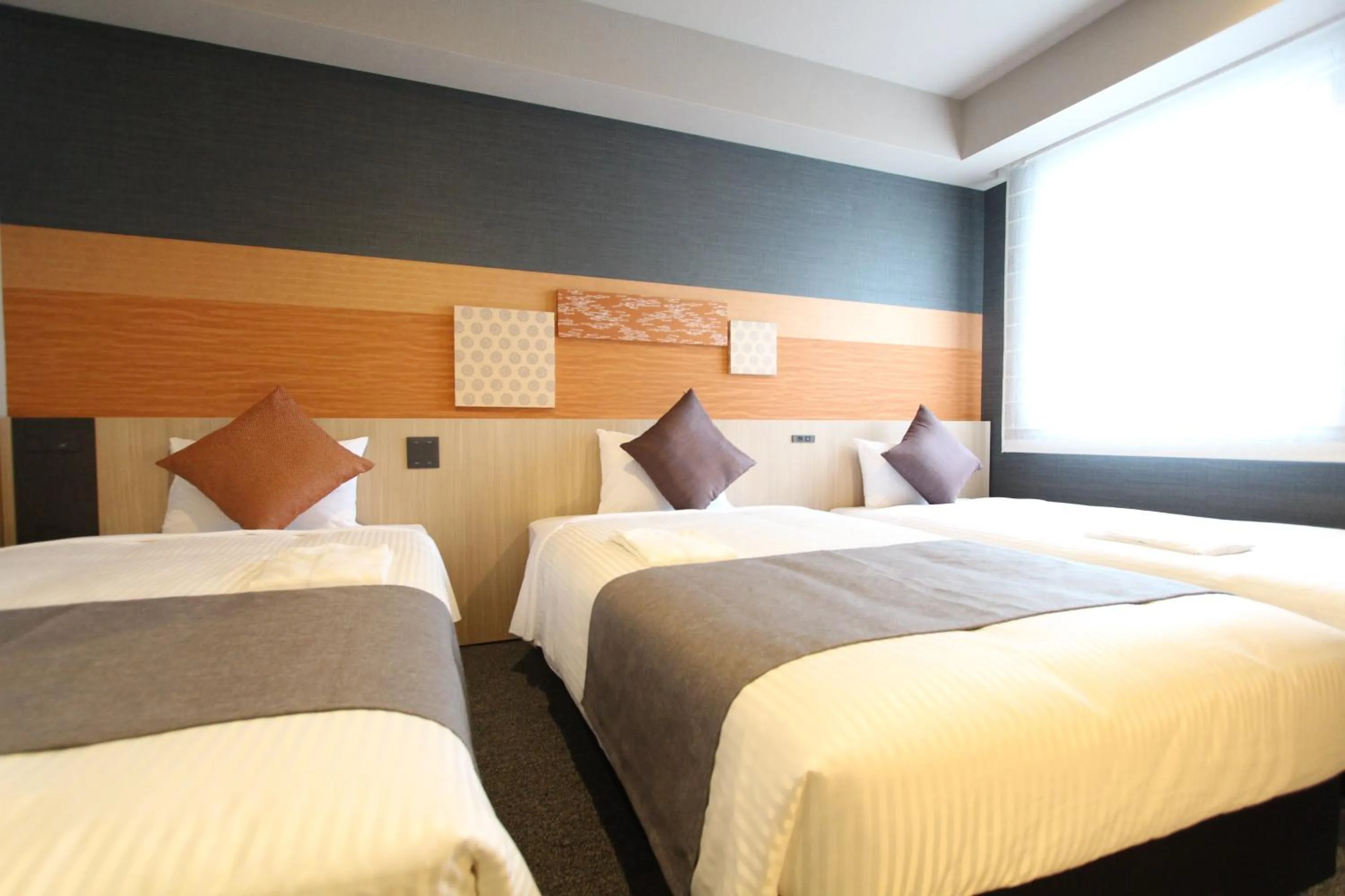 Bed in KOKO HOTEL Tsukiji Ginza