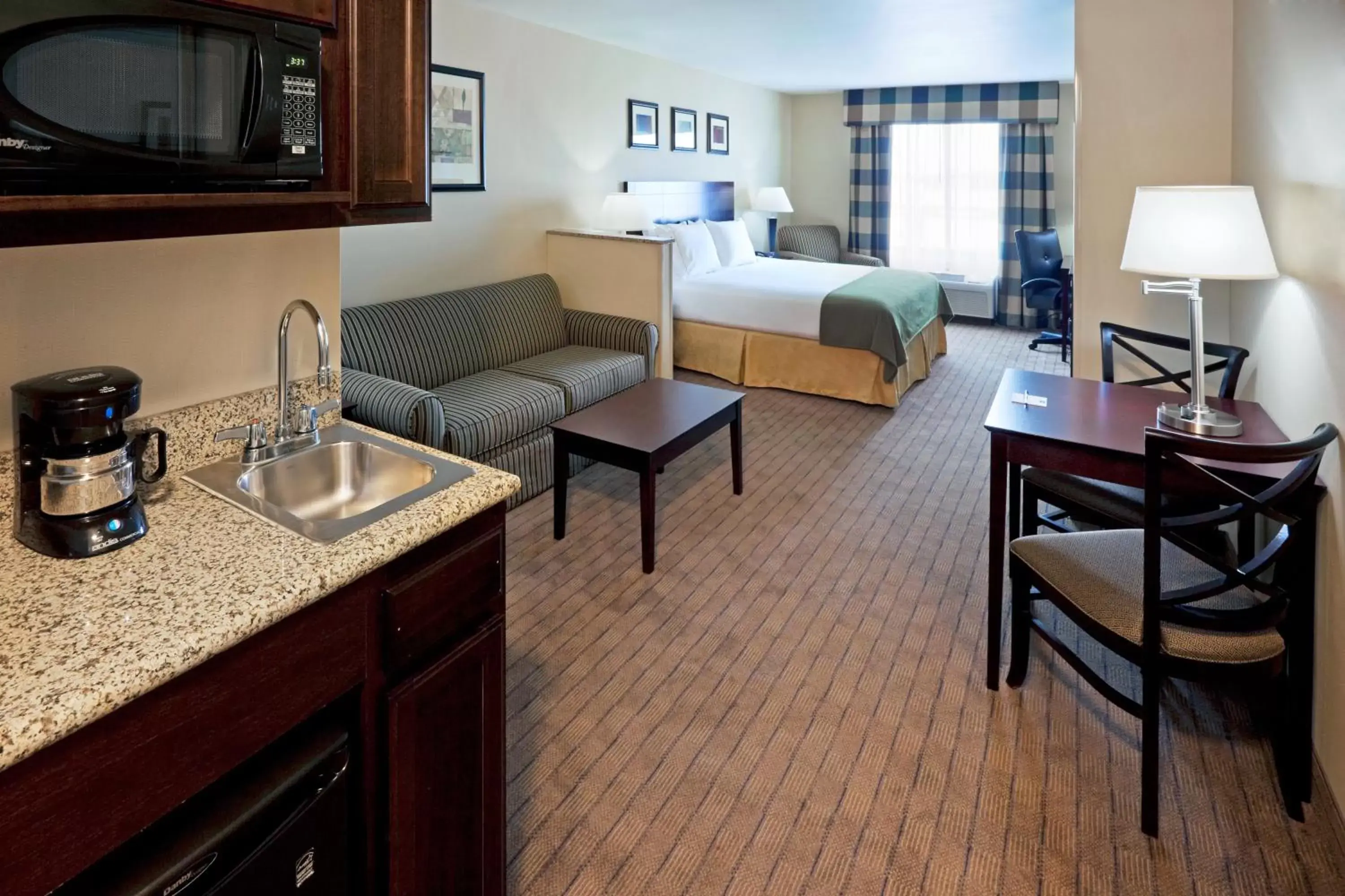 Bedroom in Holiday Inn Express Hotel & Suites Syracuse North Airport Area, an IHG Hotel