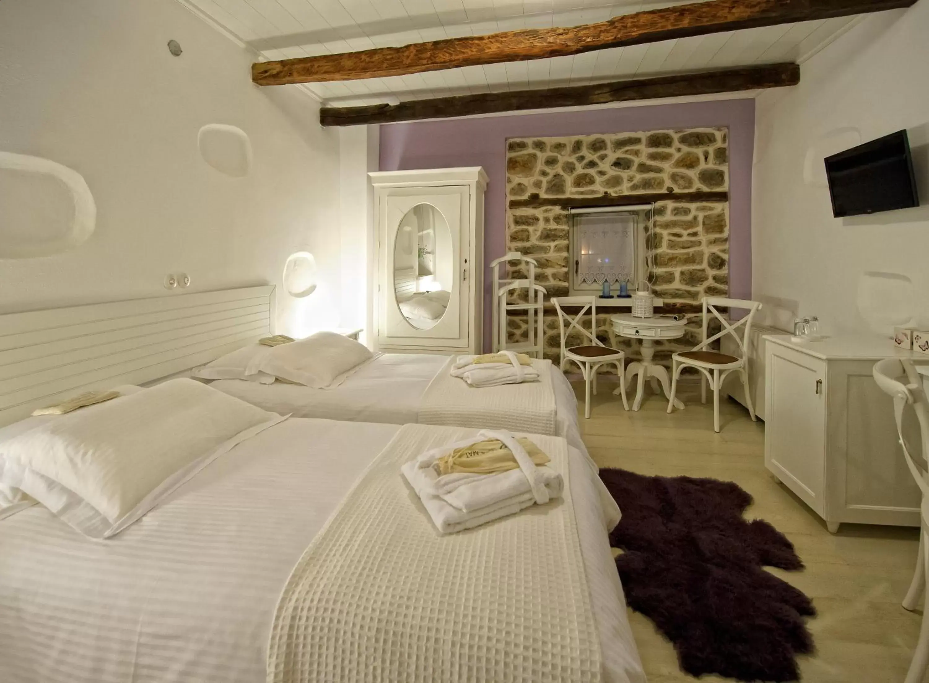 Bed in Orologopoulos Mansion Luxury Hotel