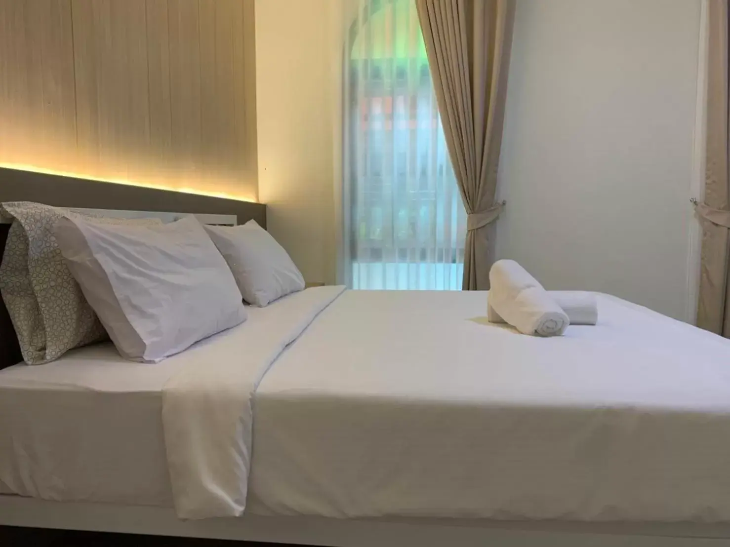 Bed in Baansuanprannok Hotel