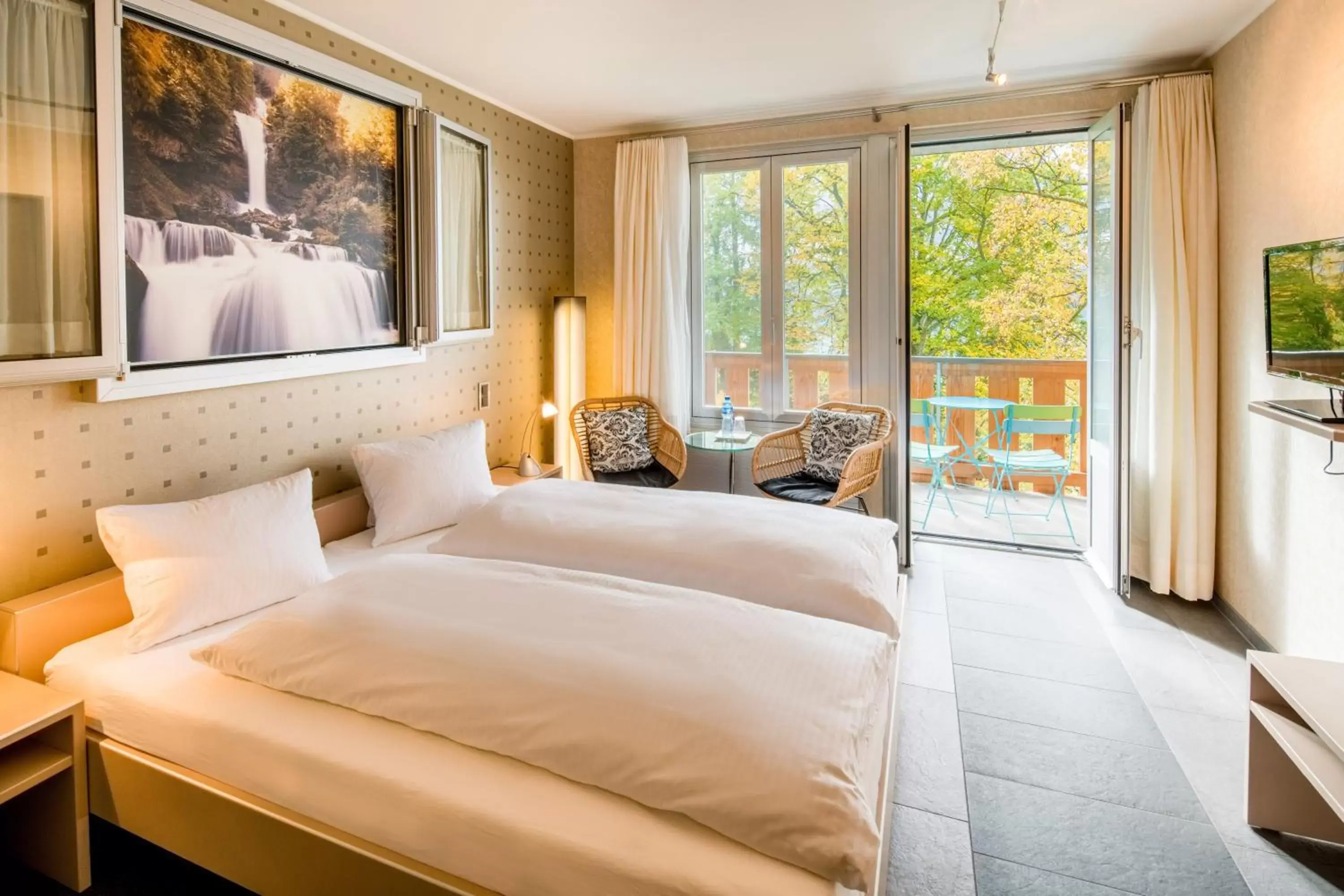 Photo of the whole room, Bed in Hotel Lindenhof by Crossworld AG