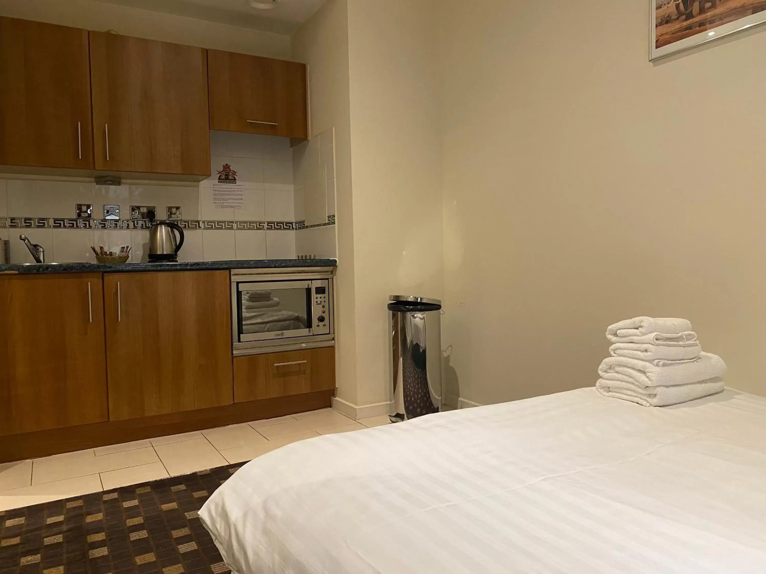 Living room, Kitchen/Kitchenette in Grand Plaza Serviced Apartments