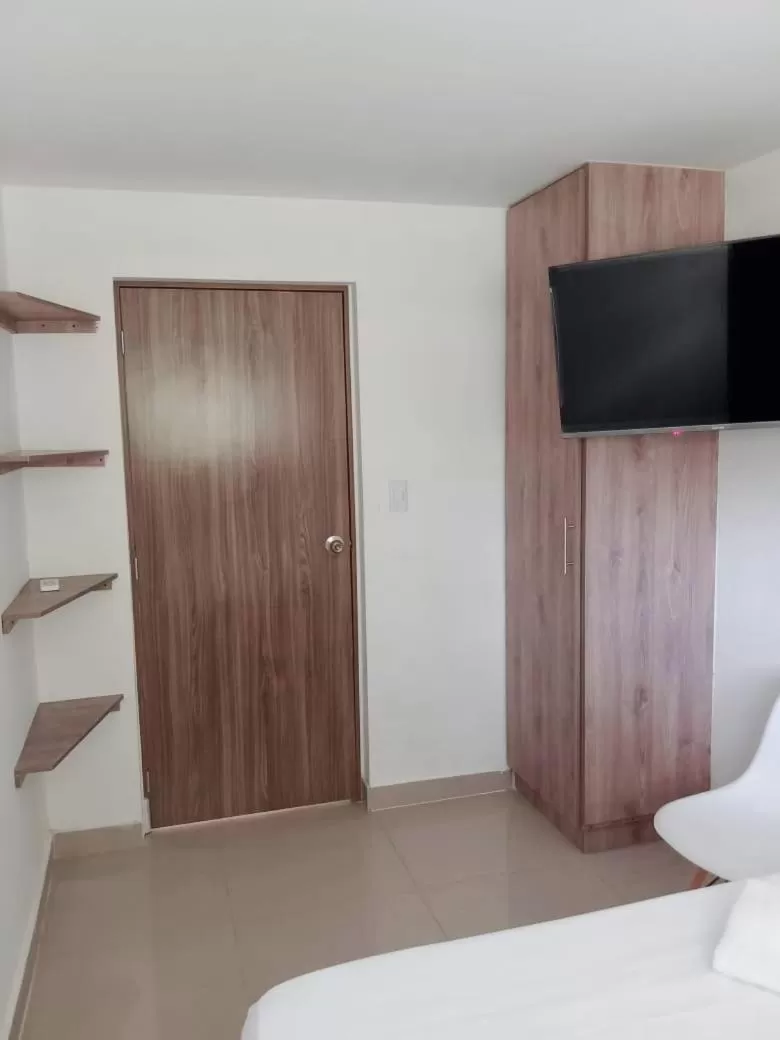 Bed, TV/Entertainment Center in Aw Hotel Pasarela Real