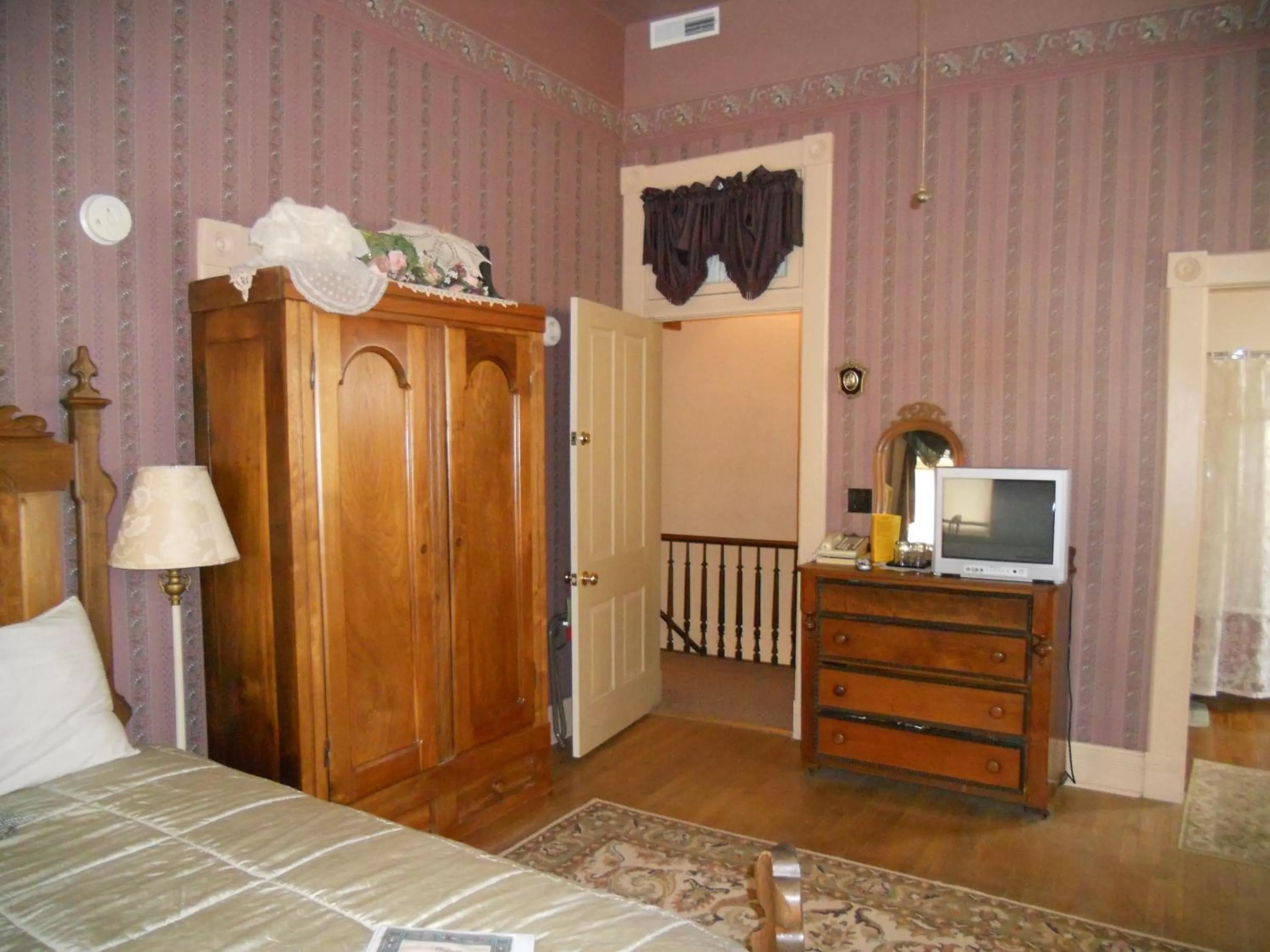 Photo of the whole room, TV/Entertainment Center in LandMark Inn at the Historic Bank of Oberlin