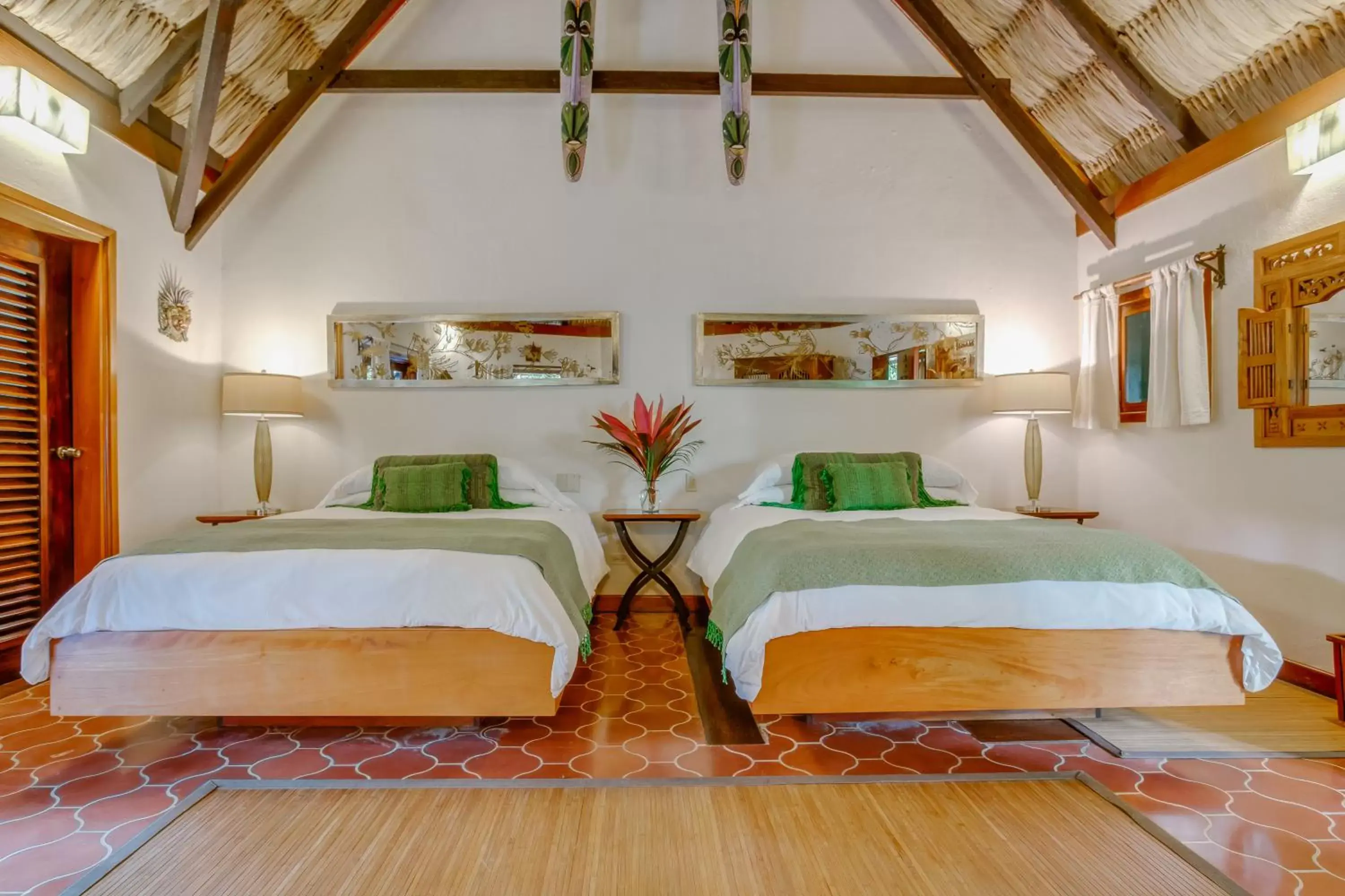 Bed in The Lodge at ChaaCreek Bed in The Lodge at ChaaCreek