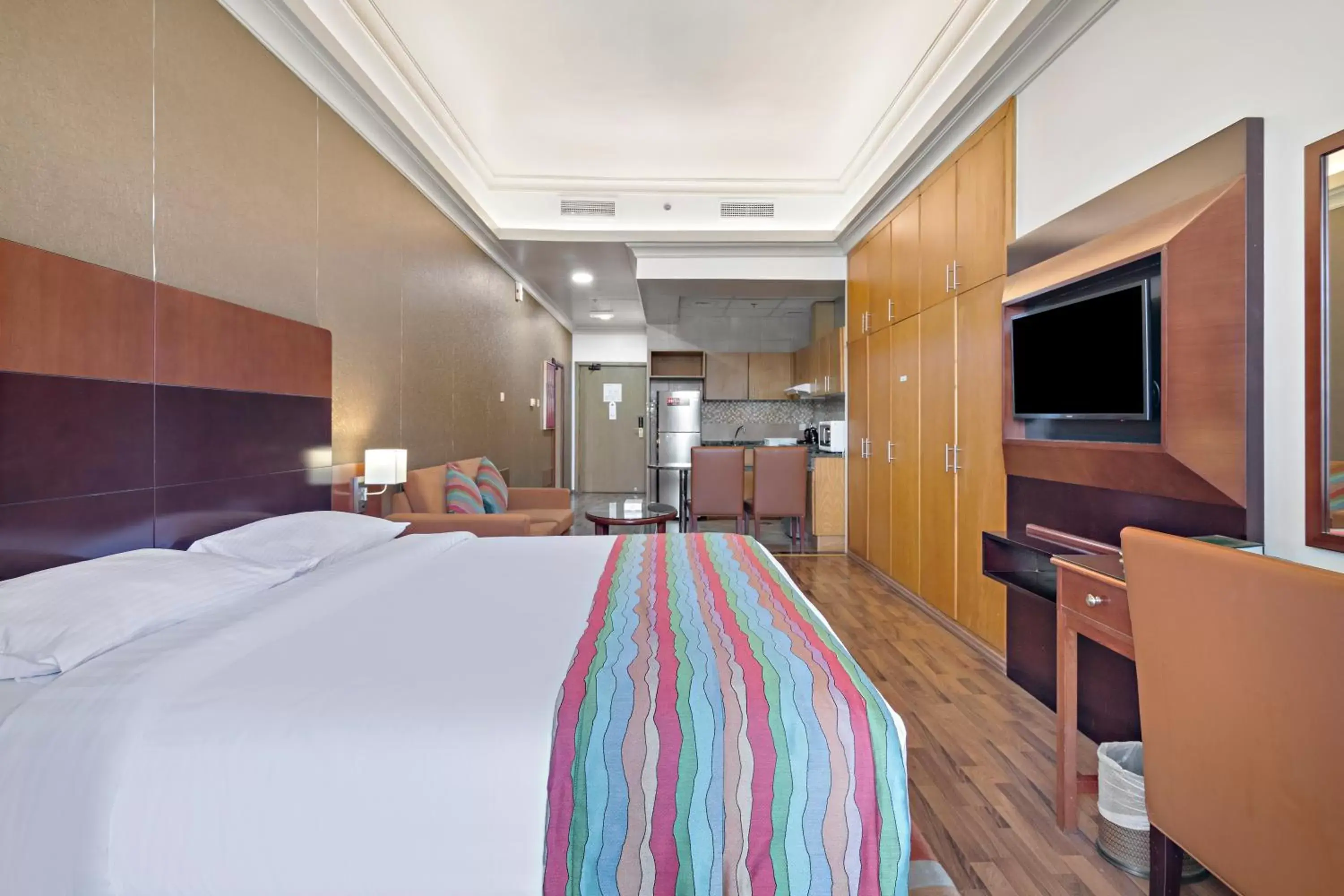 Bed, TV/Entertainment Center in Al Khoory Hotel Apartments Al Barsha