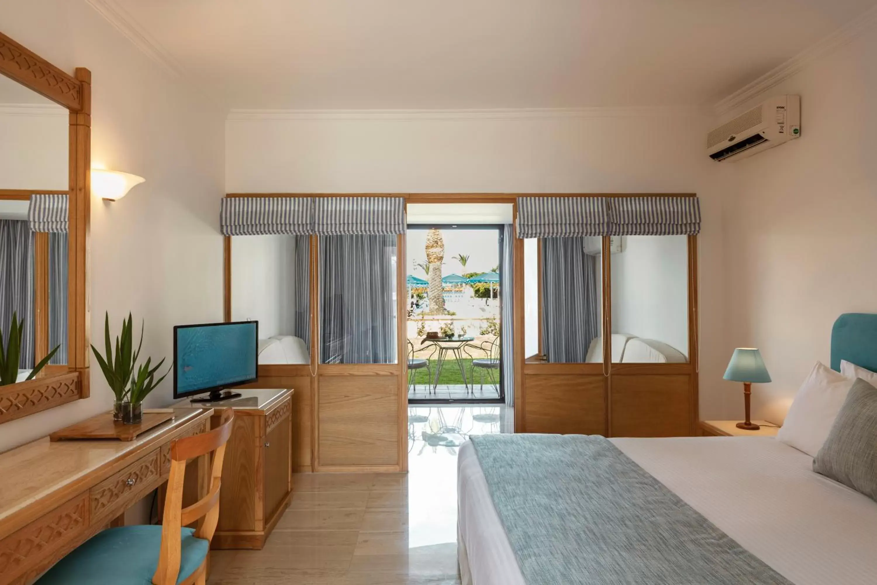 Bedroom, TV/Entertainment Center in Mitsis Ramira Beach Hotel