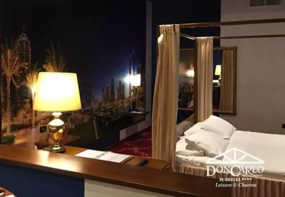 Bed in Hotel Don Carlo