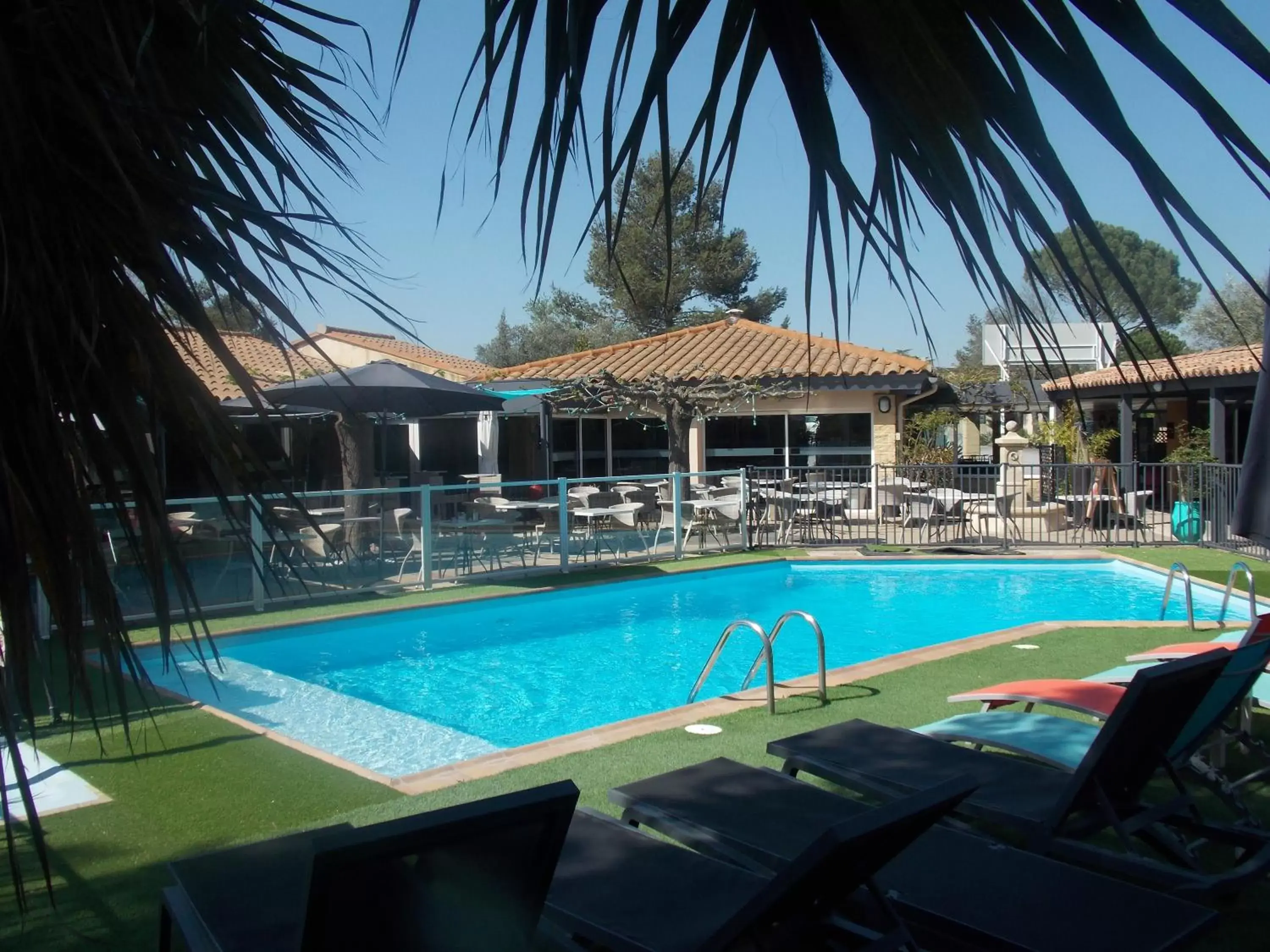 Patio, Swimming Pool in Logis Hotel Restaurant Uzès Pont du Gard
