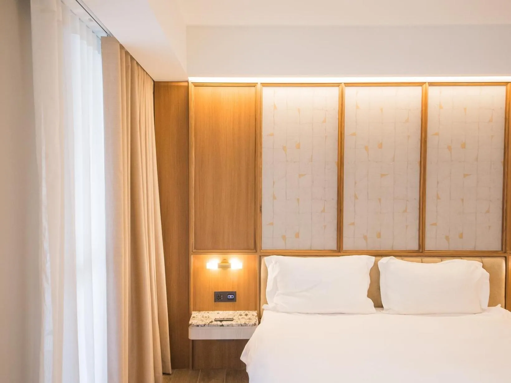 Bed in Hôtel de Ľeau