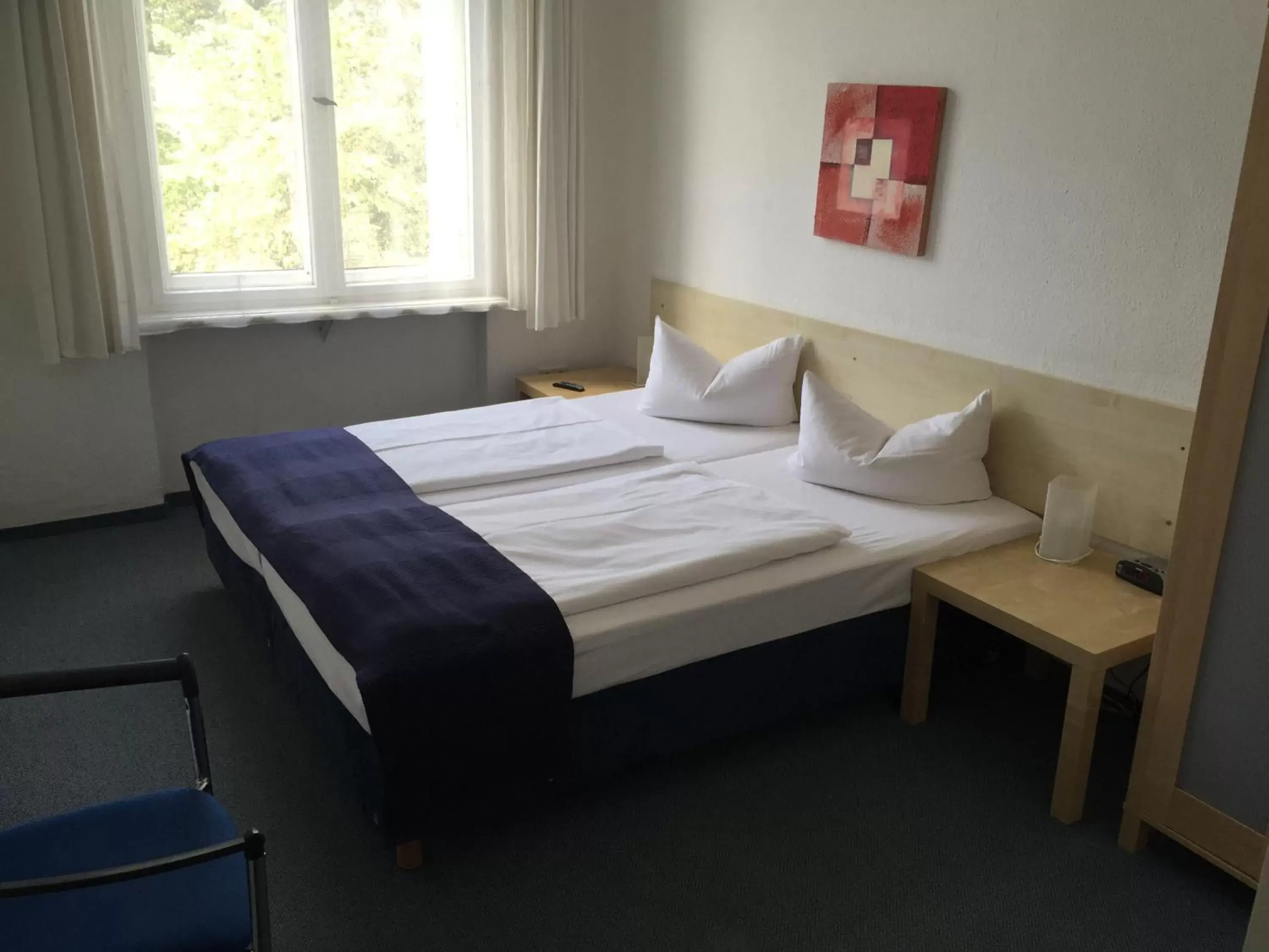 Bed in Hotel Seifert Berlin am Kurfürstendamm