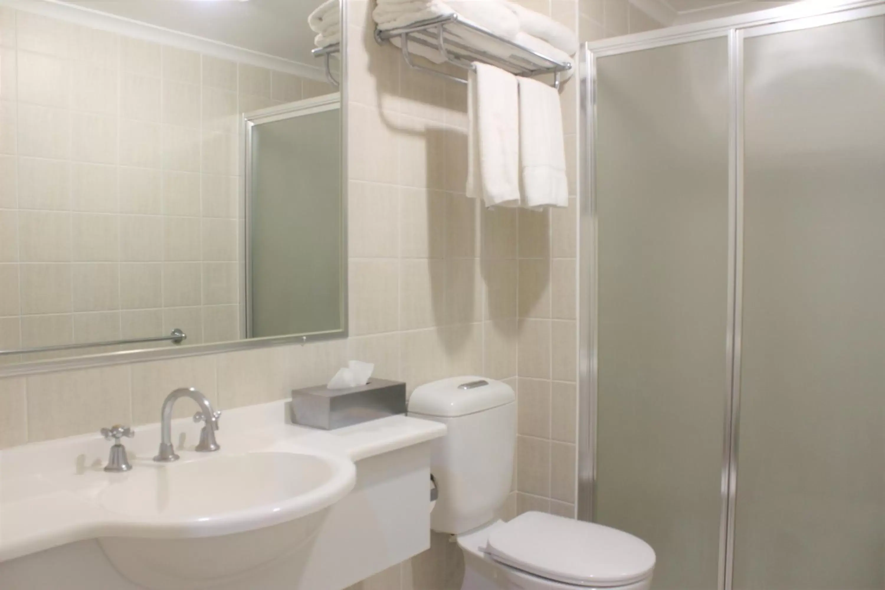 Shower, Bathroom in Carlyle Suites & Apartments
