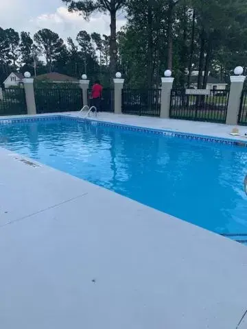 Swimming Pool in Microtel Inn & Suites by Wyndham Camp Lejeune/Jacksonville