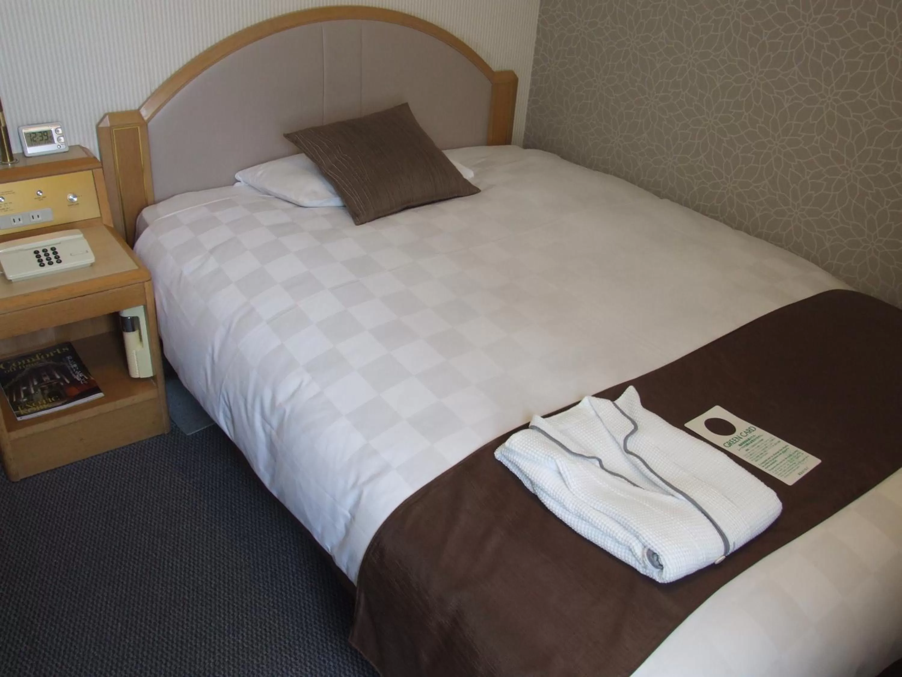 Bed in Matsuyama Tokyu REI Hotel