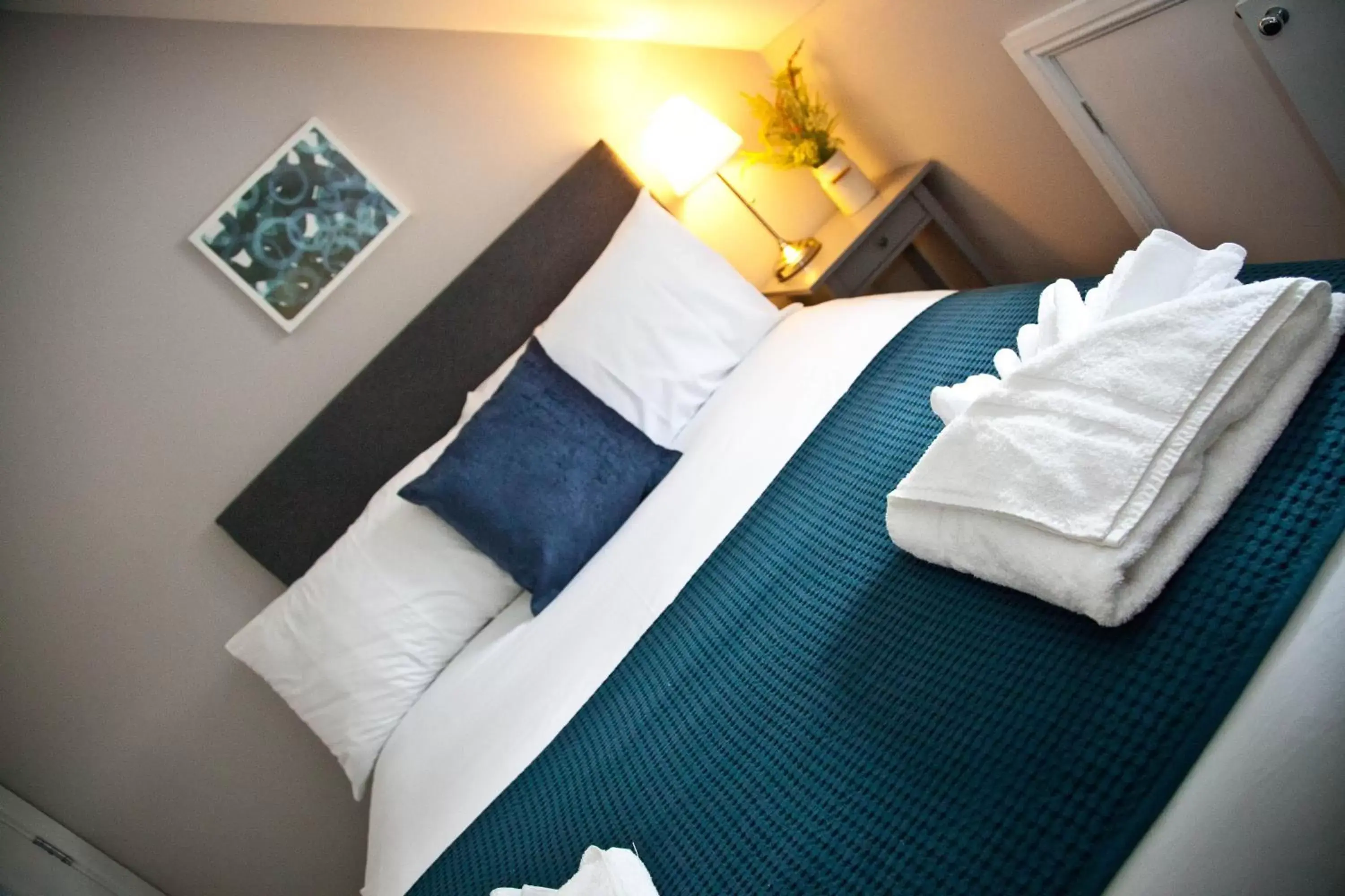 towels, Bed in Rowton Poplars Hotel
