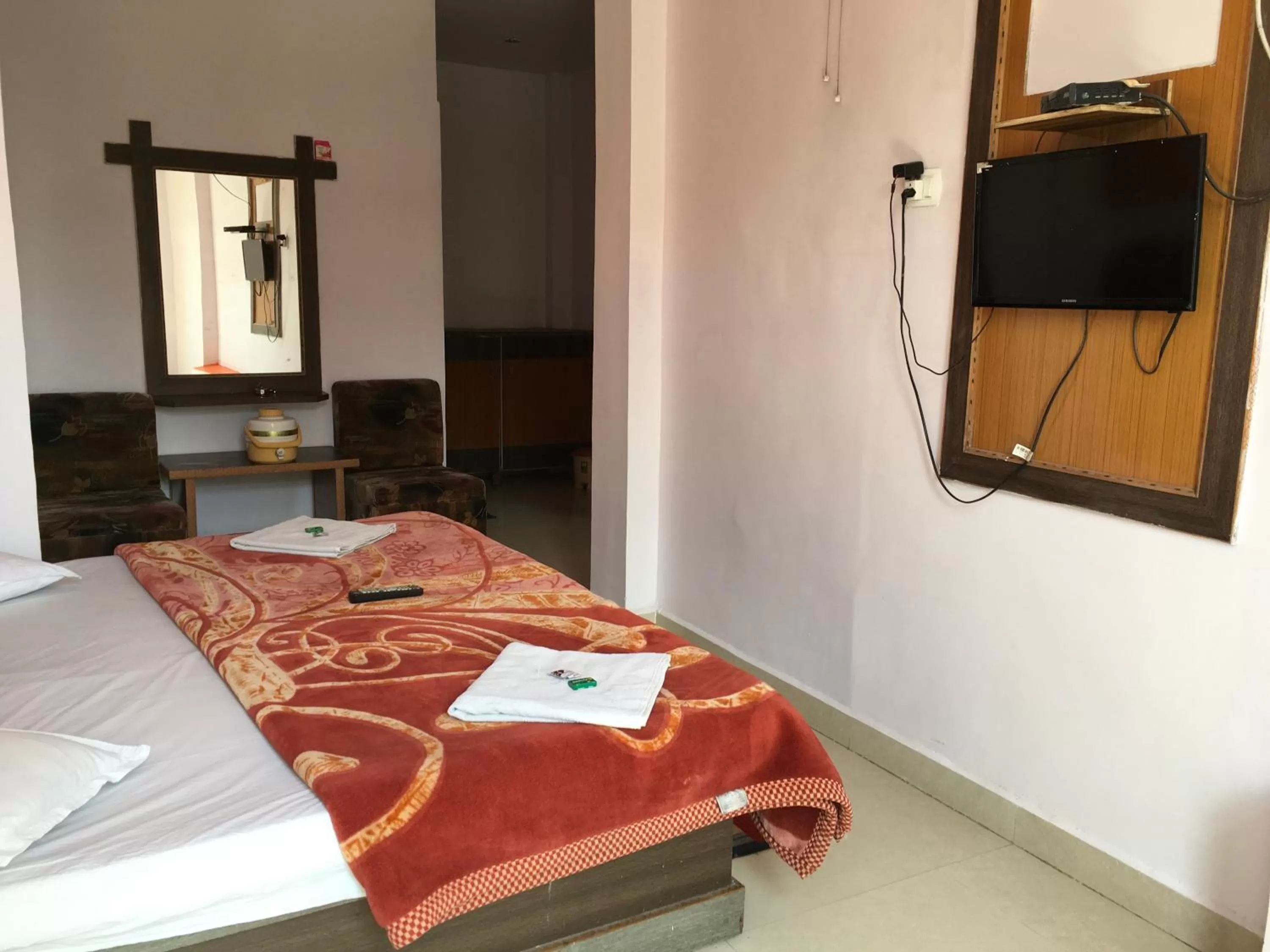 Bed, TV/Entertainment Center in Hotel RAJVIHAR
