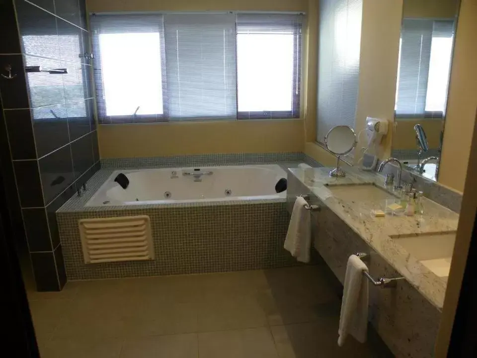 Bathroom in Ramada by Wyndham Furnaspark