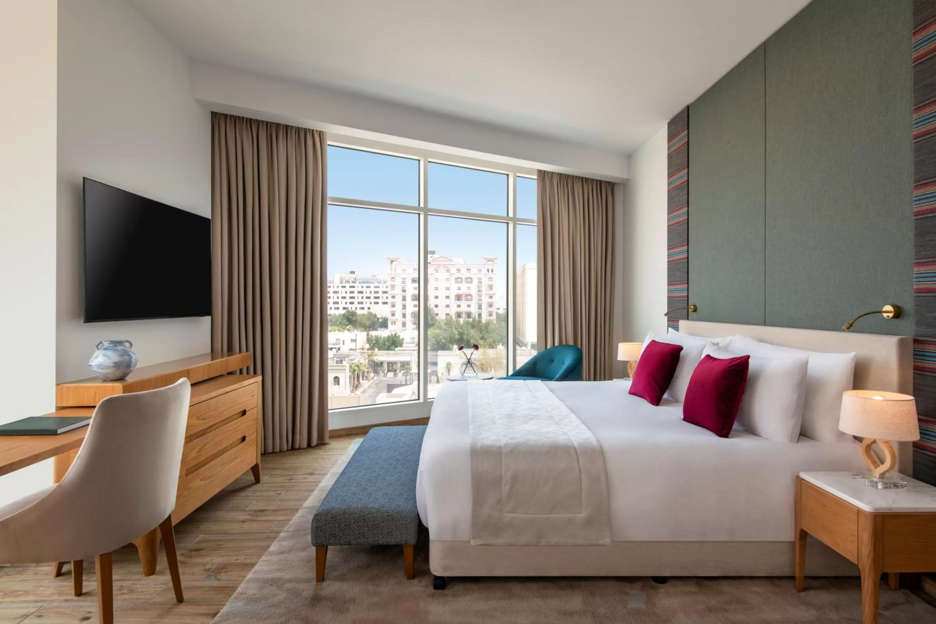 Communal lounge/ TV room, Bed in Abesq Doha Hotel and Residences, an IHG Hotel